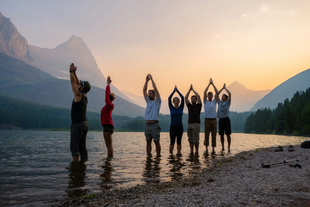 yoga group with mountains in the background
