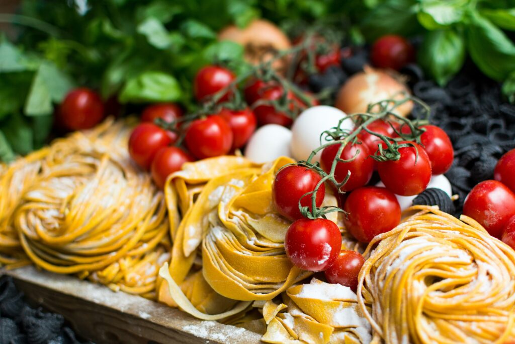 italian food - tomatoes and tagliatelle
