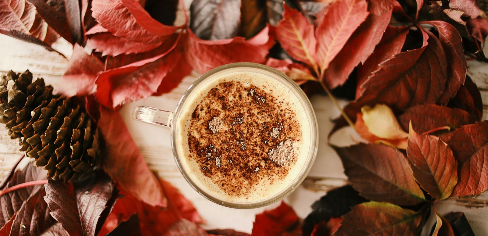 Cup of coffee with red leafs