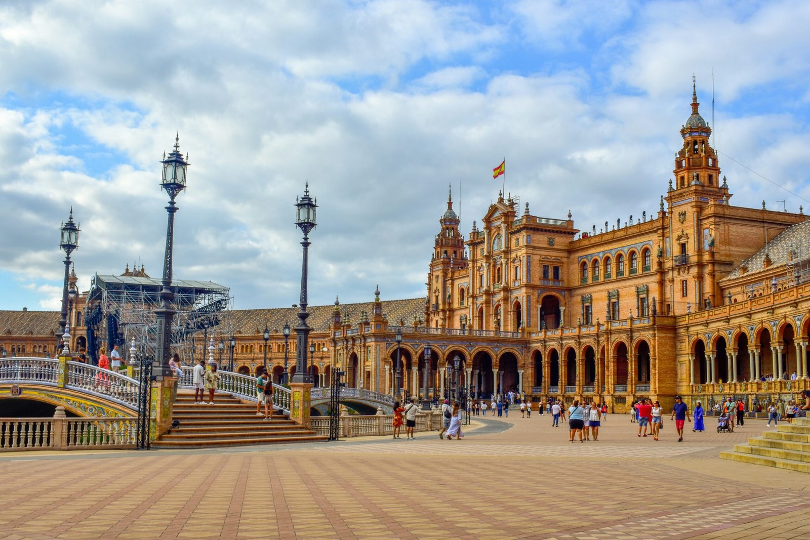 Plaza de España in Seville, Spain, with open walkways, blue sky, and a bright spring atmosphere.