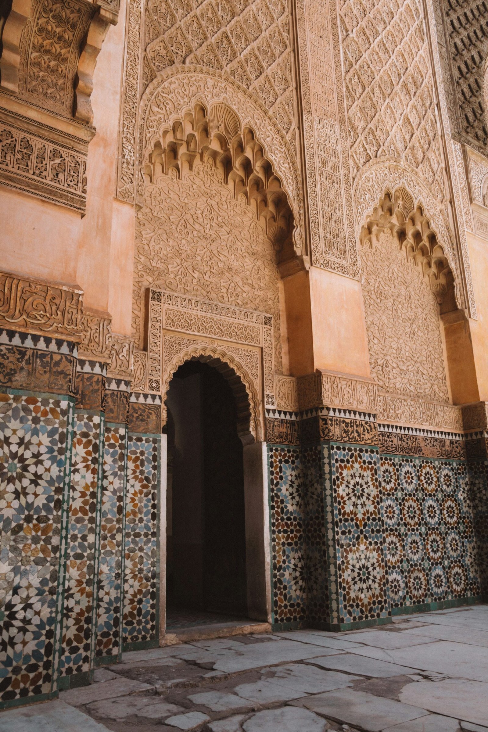 sunlit marrakesh courtyard with geometric tiles and soft autumn shade