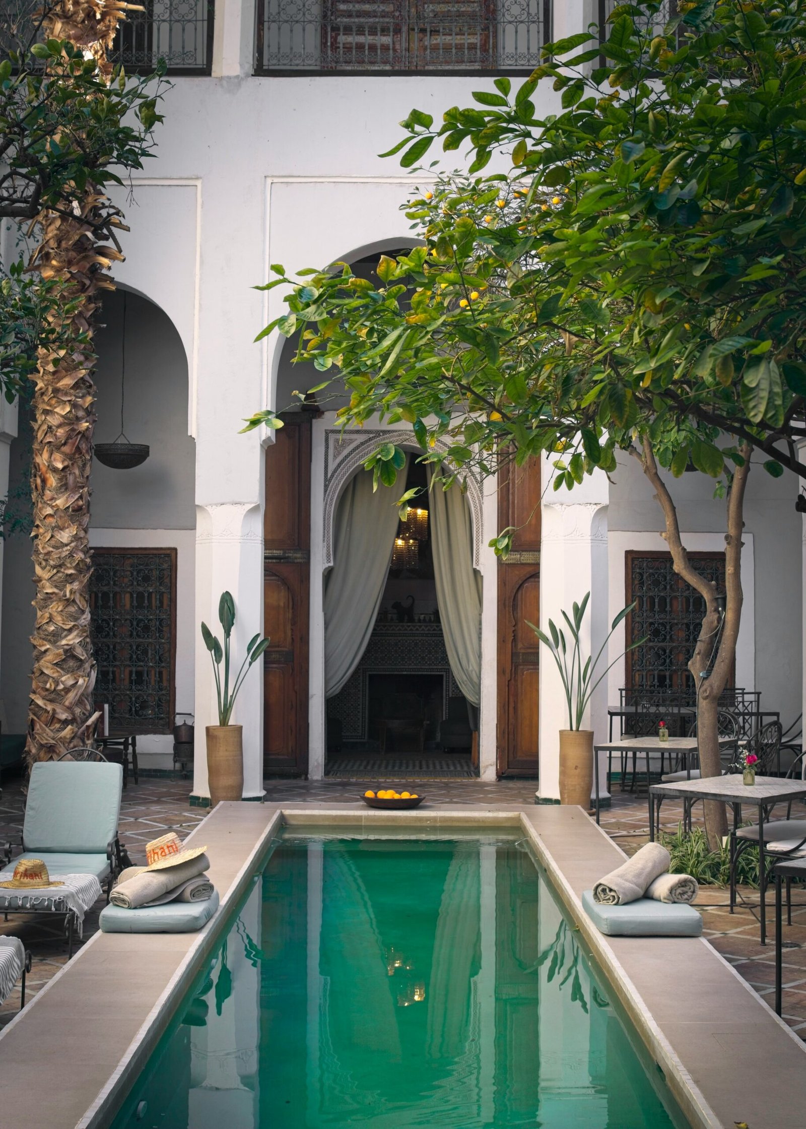 shaded riad courtyard in marrakesh with pool and elegant moroccan design
