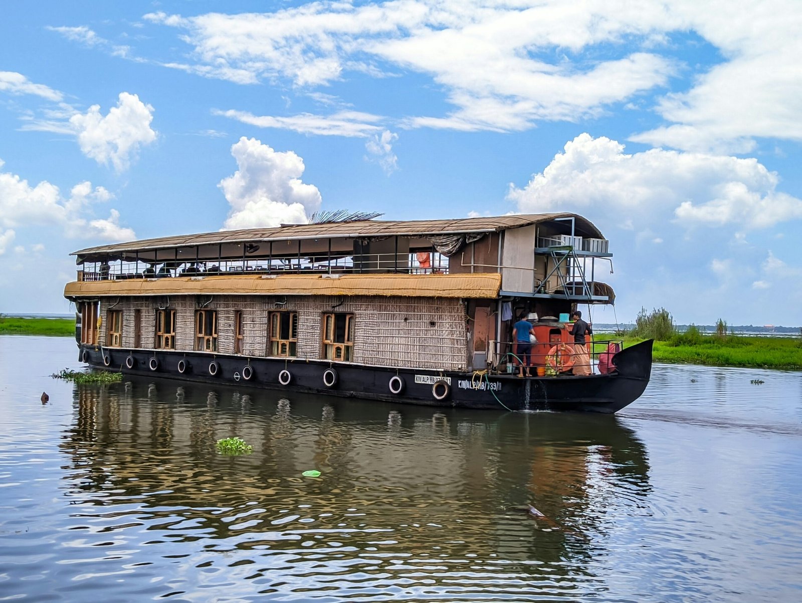 Houseboat floating through the Alappuzha backwaters, reflecting the slow and restorative rhythm of a year-end retreat in Kerala.