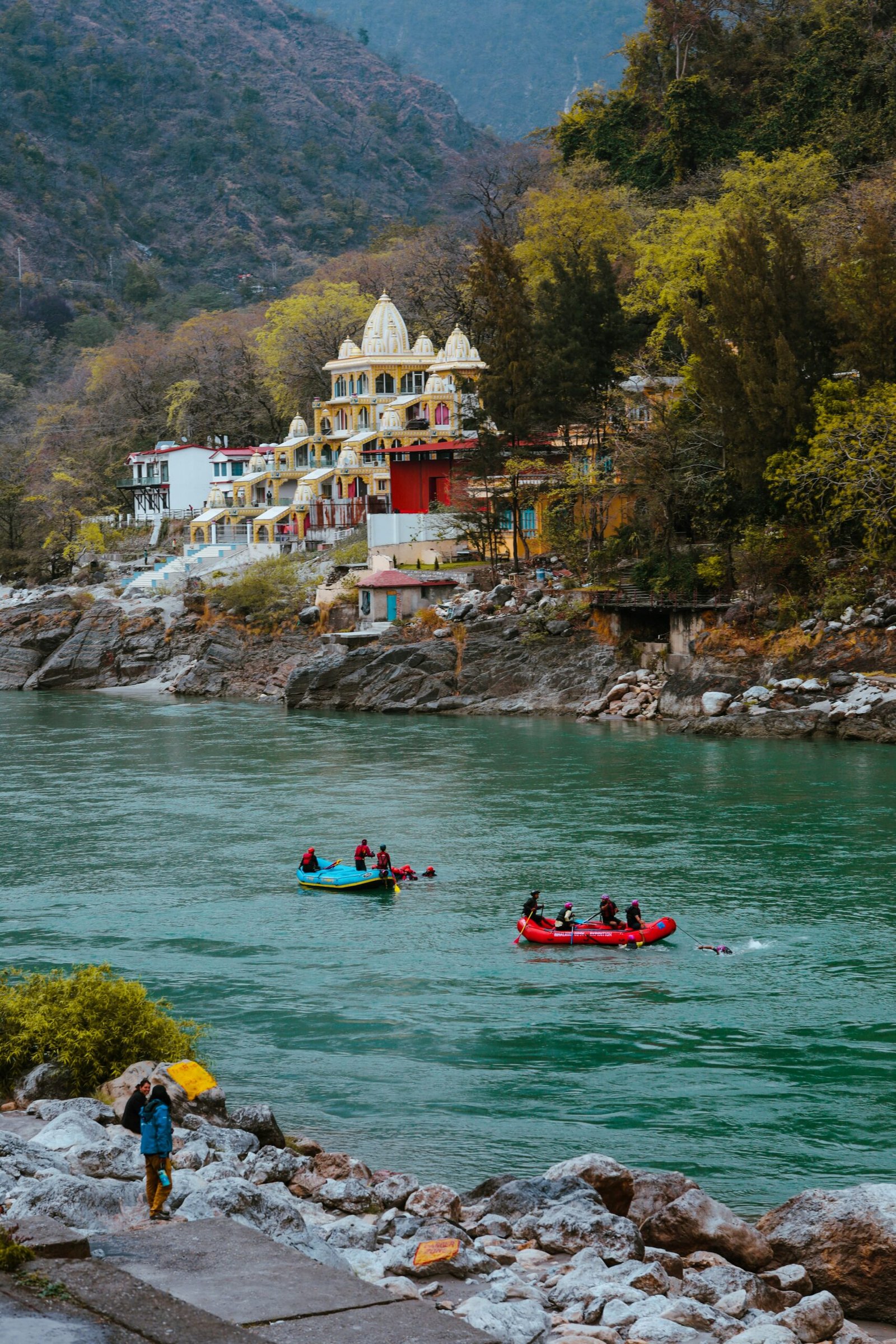 Group rafting near Laxman Jhula in Rishikesh, capturing the adventurous and community-driven side of a retreat in northern India.
