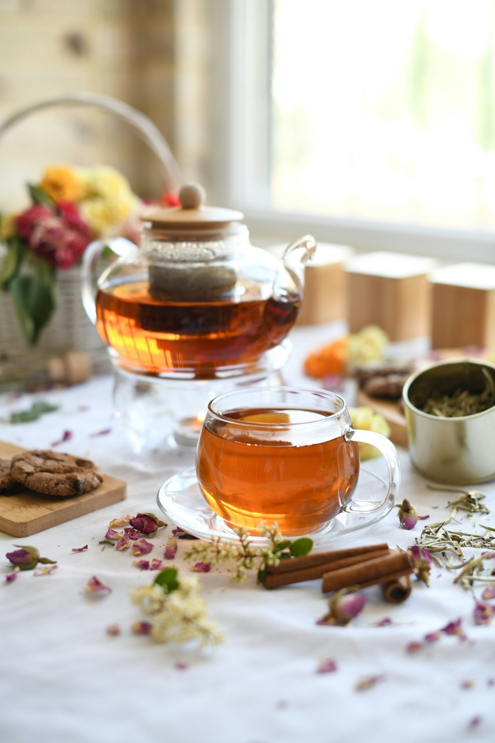 Teacup and teapot with herbs for a slow, calming pause during a July retreat.