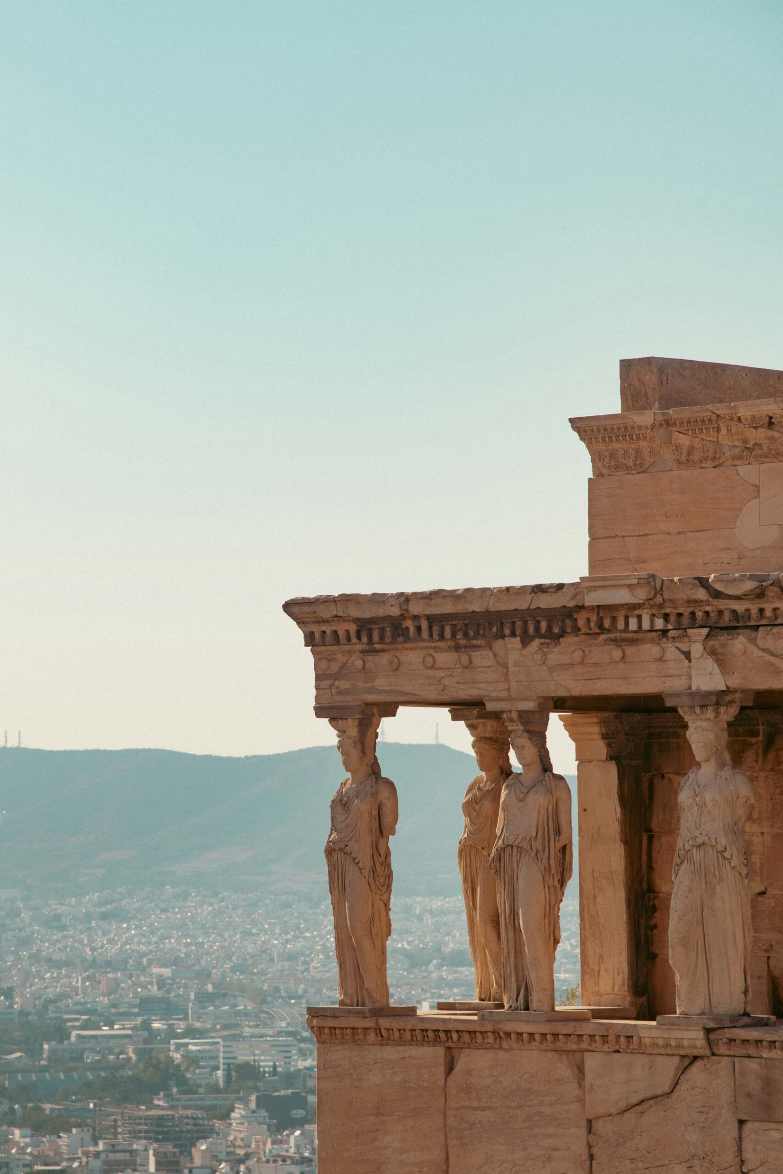 Elevated city view framed by stone columns, giving a spacious and reflective atmosphere that suits a retreat-inspired escape.