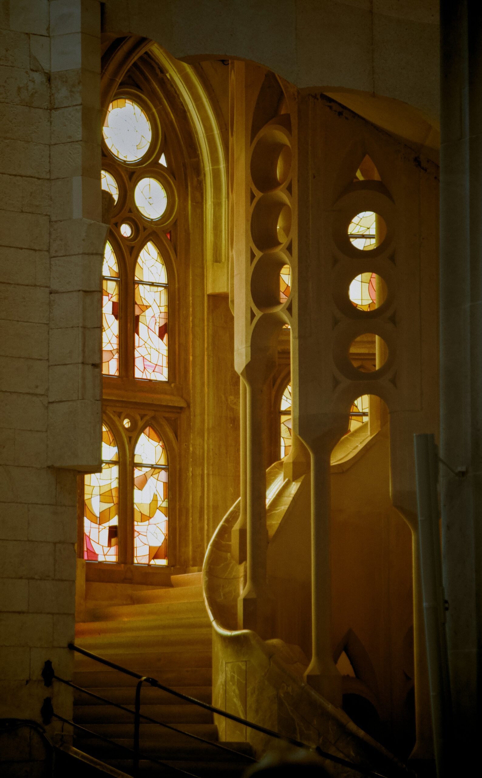 Stained glass and stairway inside the Sagrada Família in Barcelona, Spain.