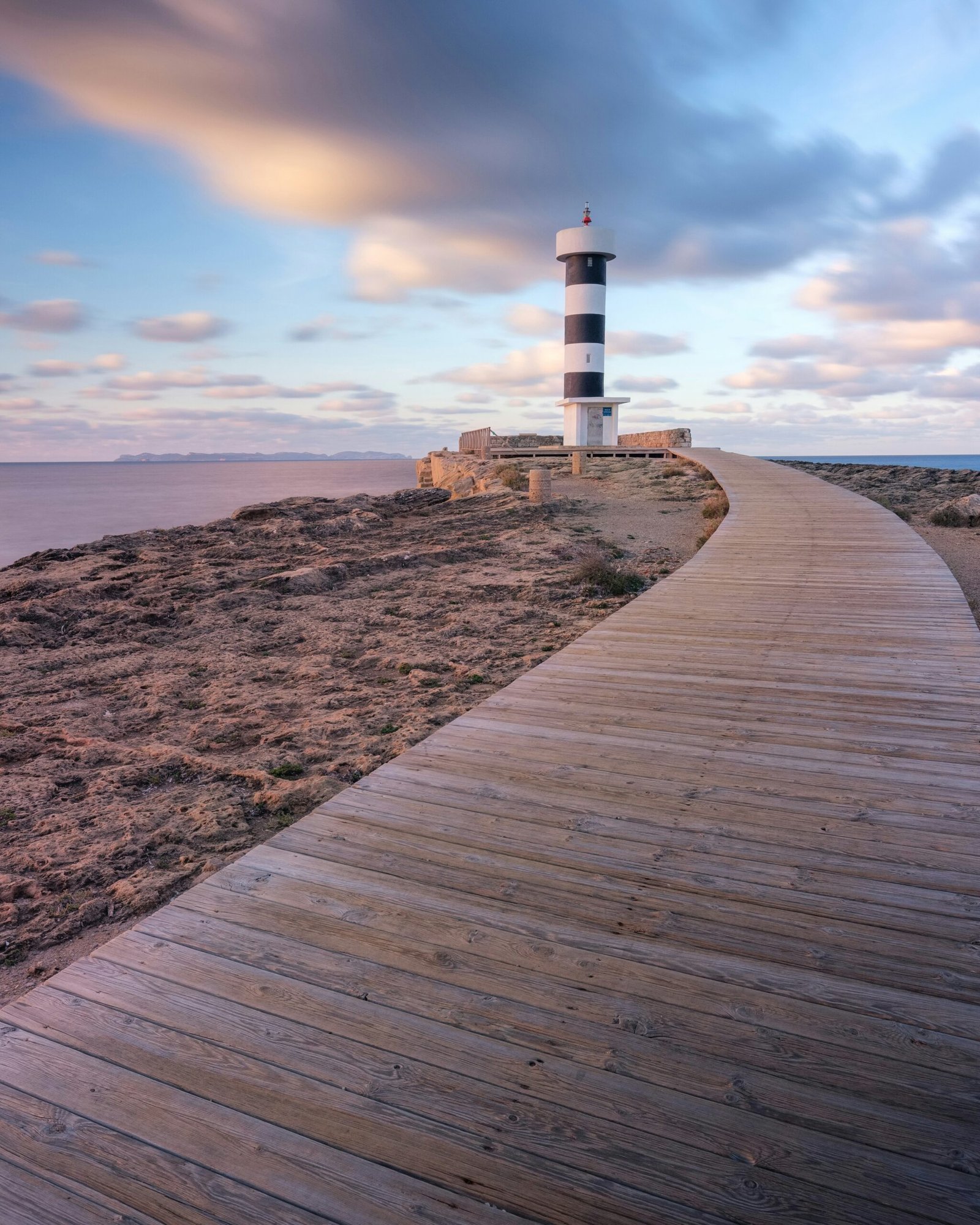 spain coastline at sunrise with calm sea and soft morning light