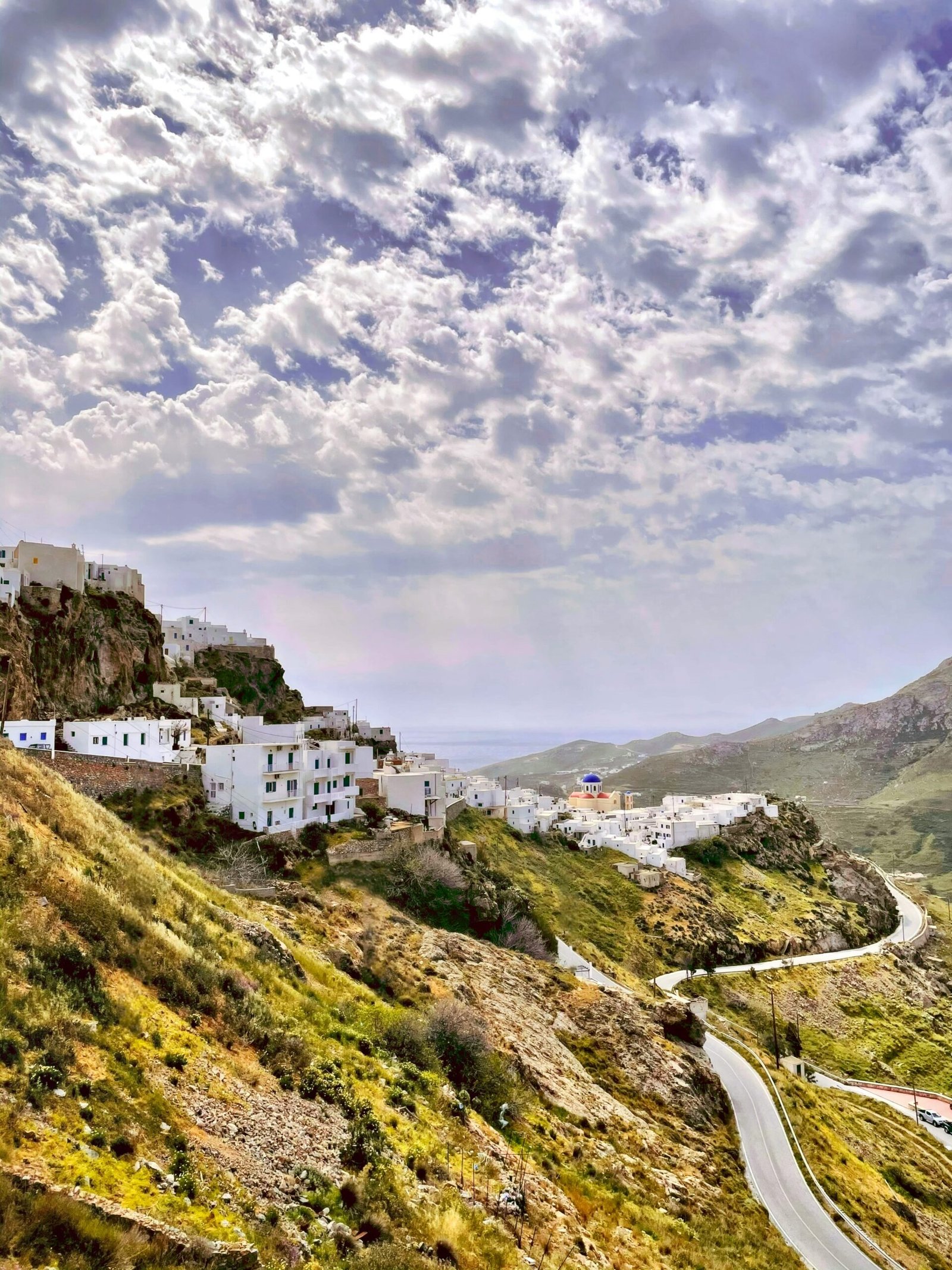 Whitewashed houses in Frigiliana, Andalusia, Spain, with mountains and clear February light.