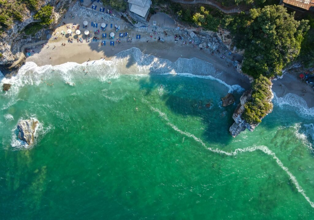 Mylopotamos beach in Pelion with clear water and rugged shoreline for a nature-led retreat by the coast.