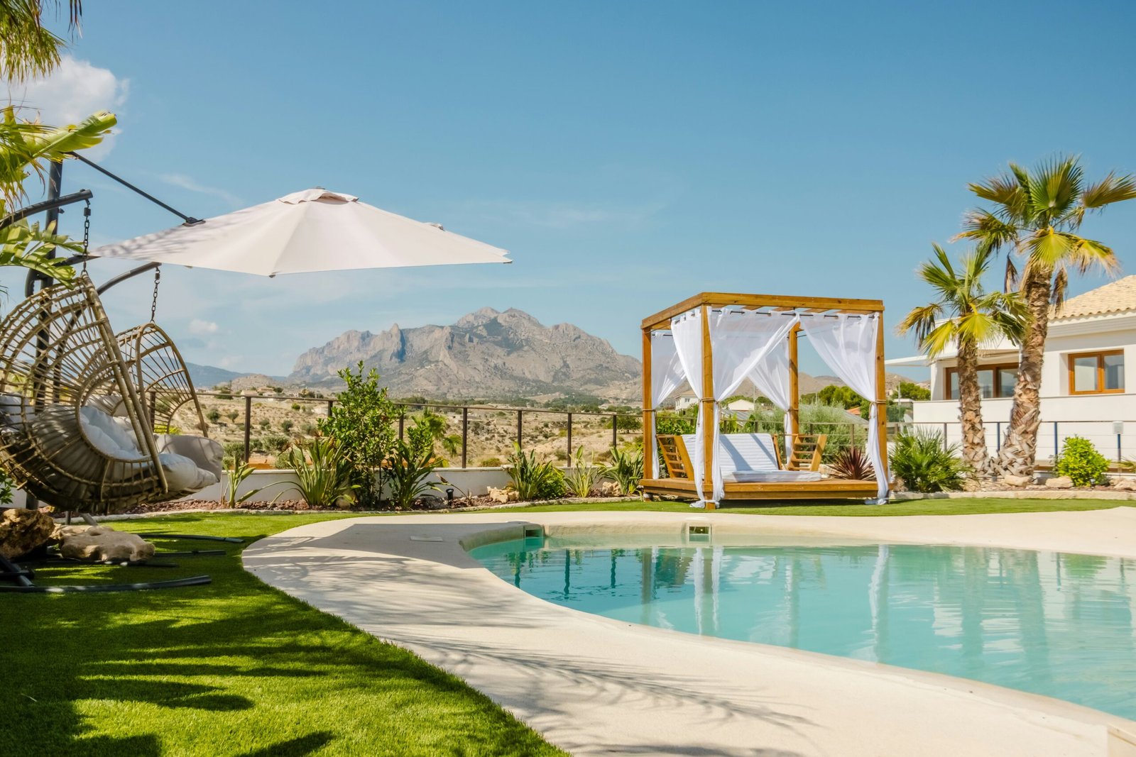 Serene mountain-view pool area at a relaxing retreat resort