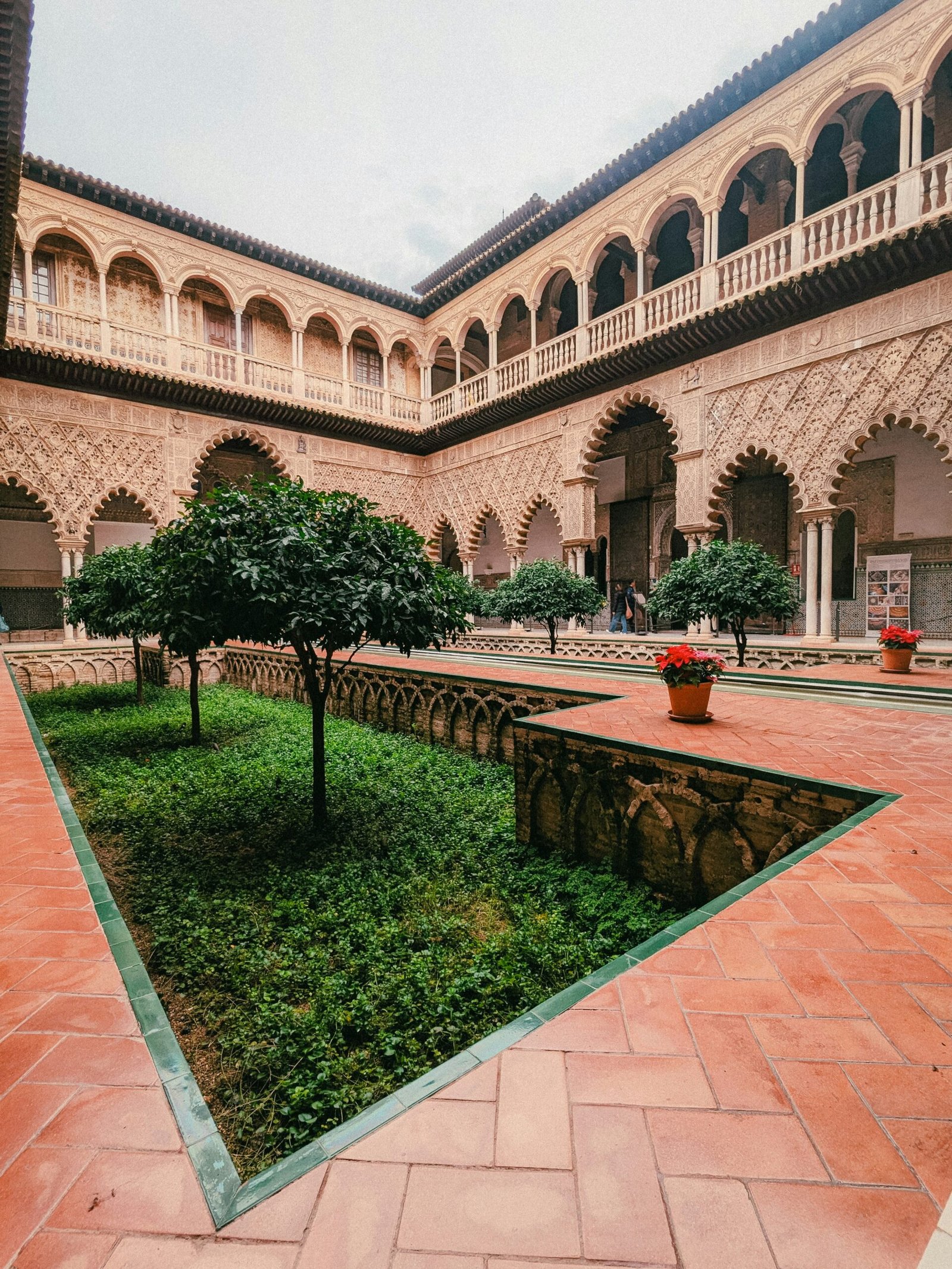 quiet andalusian courtyard with white walls and potted plants for a restorative retreat