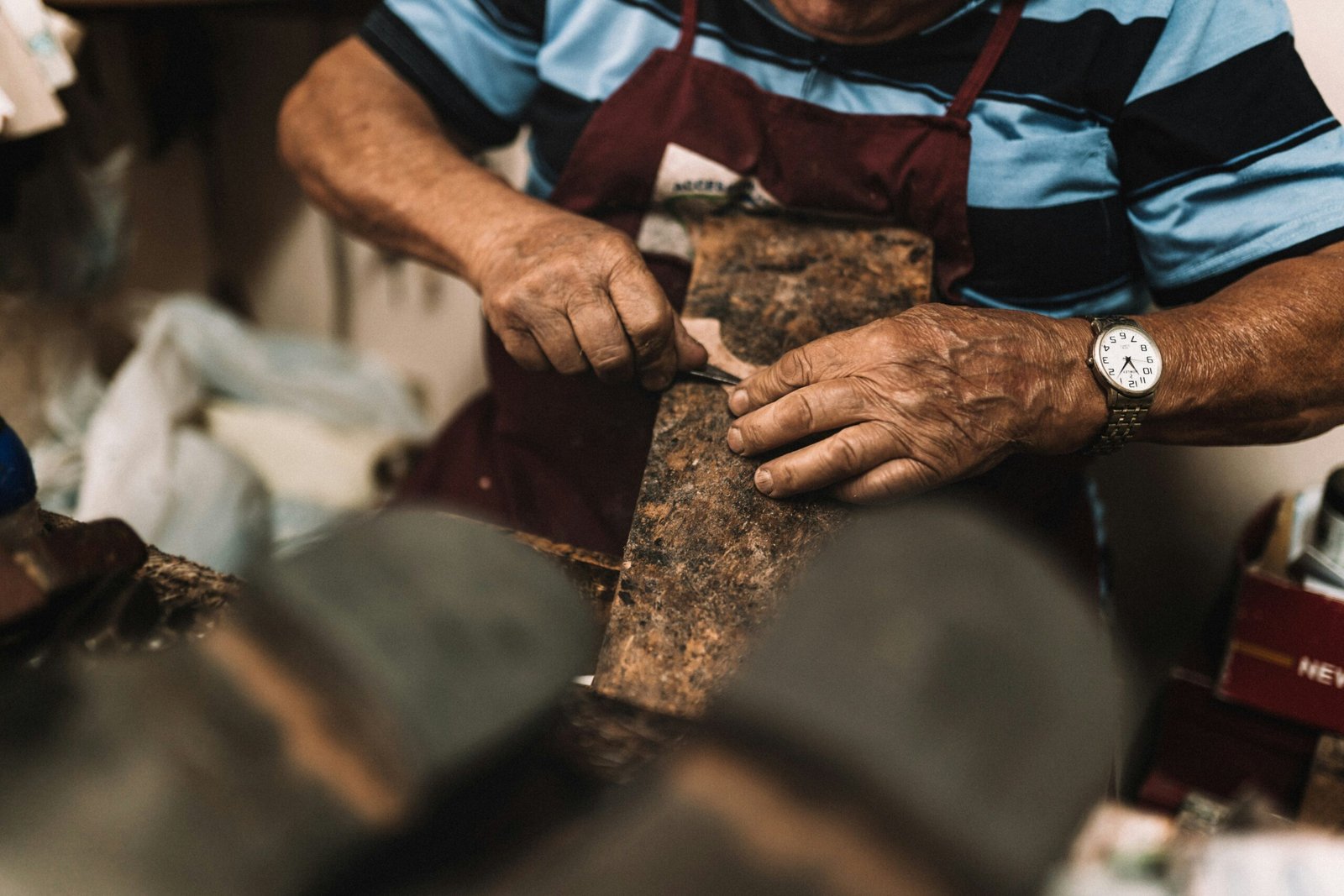 italian artisan working with wood in sicily with focus and care