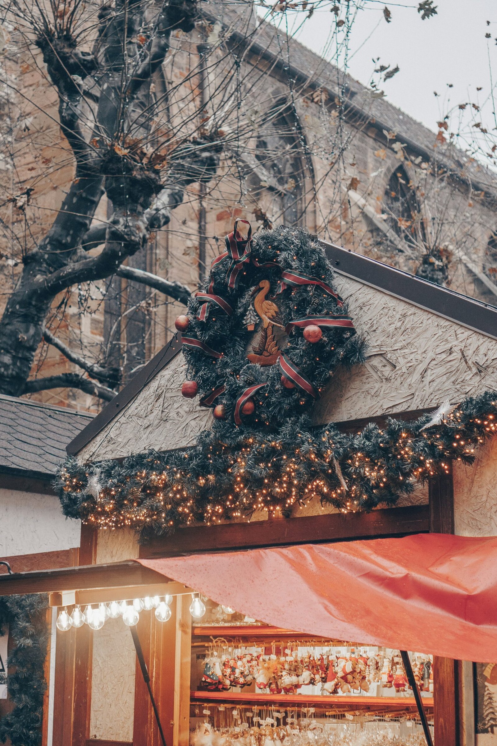 Festive building detail in Colmar, adding a charming and reflective winter mood to a France yoga retreat.