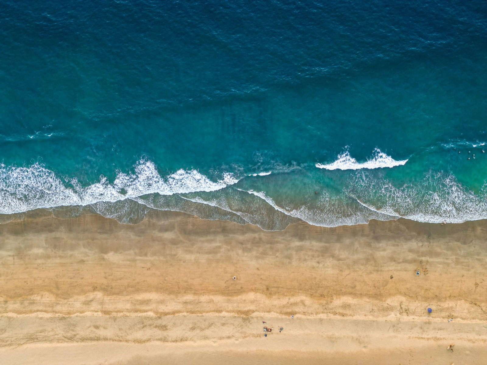 Aerial view of Agonda Beach in Goa, evoking the open and restorative coastal side of an October retreat in India.