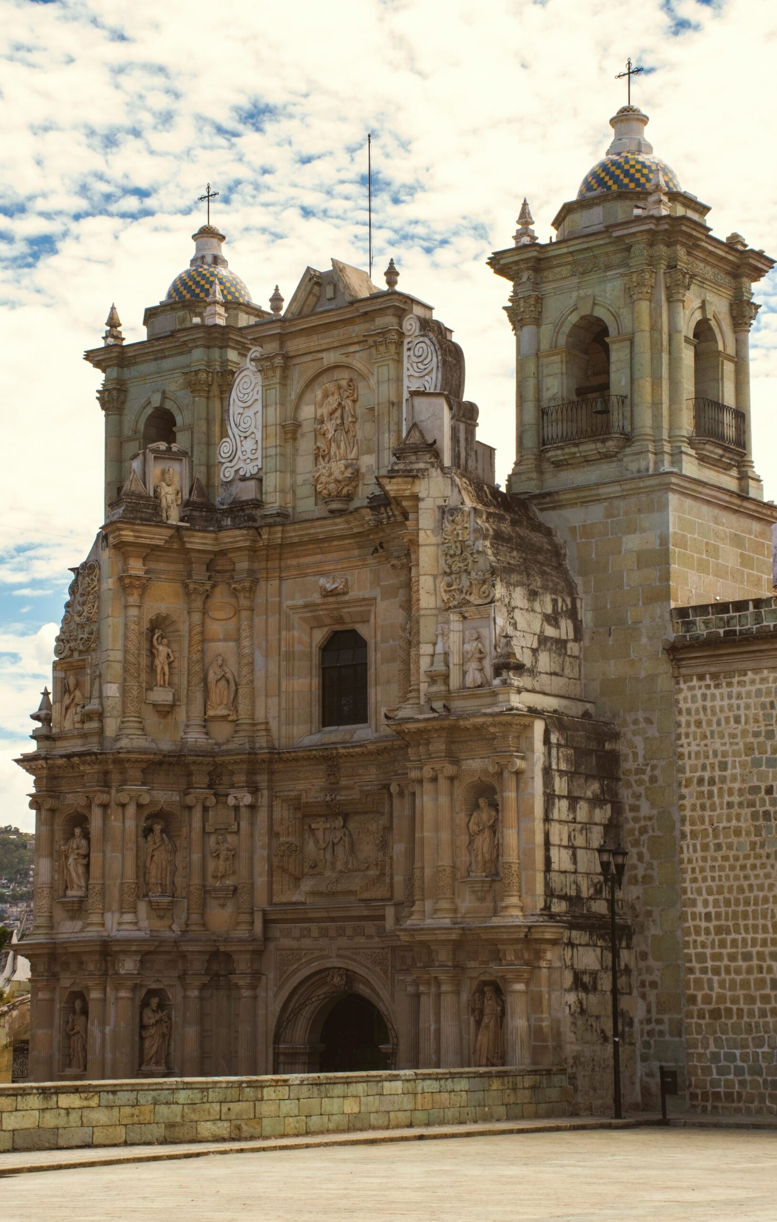 Historic church building in Oaxaca under a bright blue sky for a culturally grounded September retreat in Mexico.