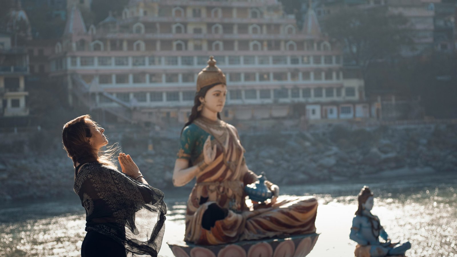https://unsplash.com/photos/a-man-standing-next-to-a-statue-of-a-woman-KHzNBiWFcGo