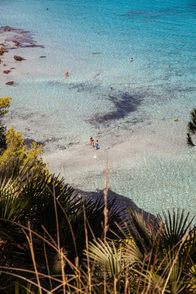 Beach in Mallorca, Spain, with turquoise water and sunlit summer atmosphere