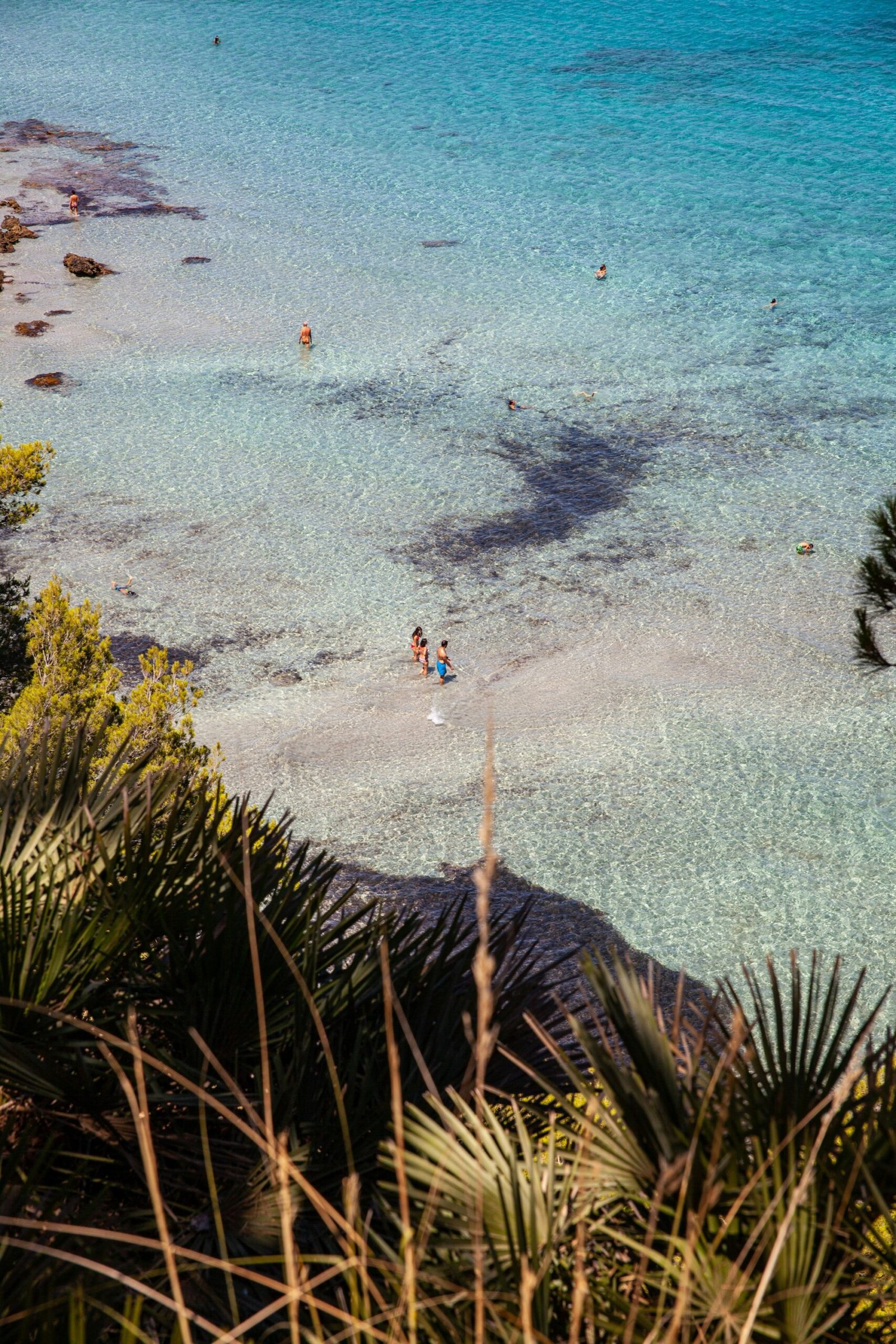 Beach in Mallorca, Spain, with turquoise water and sunlit summer atmosphere