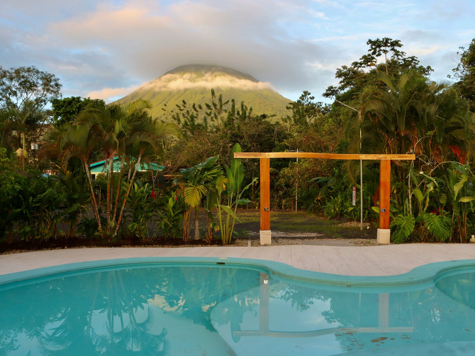 Swimming pool with Arenal Volcano in the background in La Fortuna, Costa Rica.