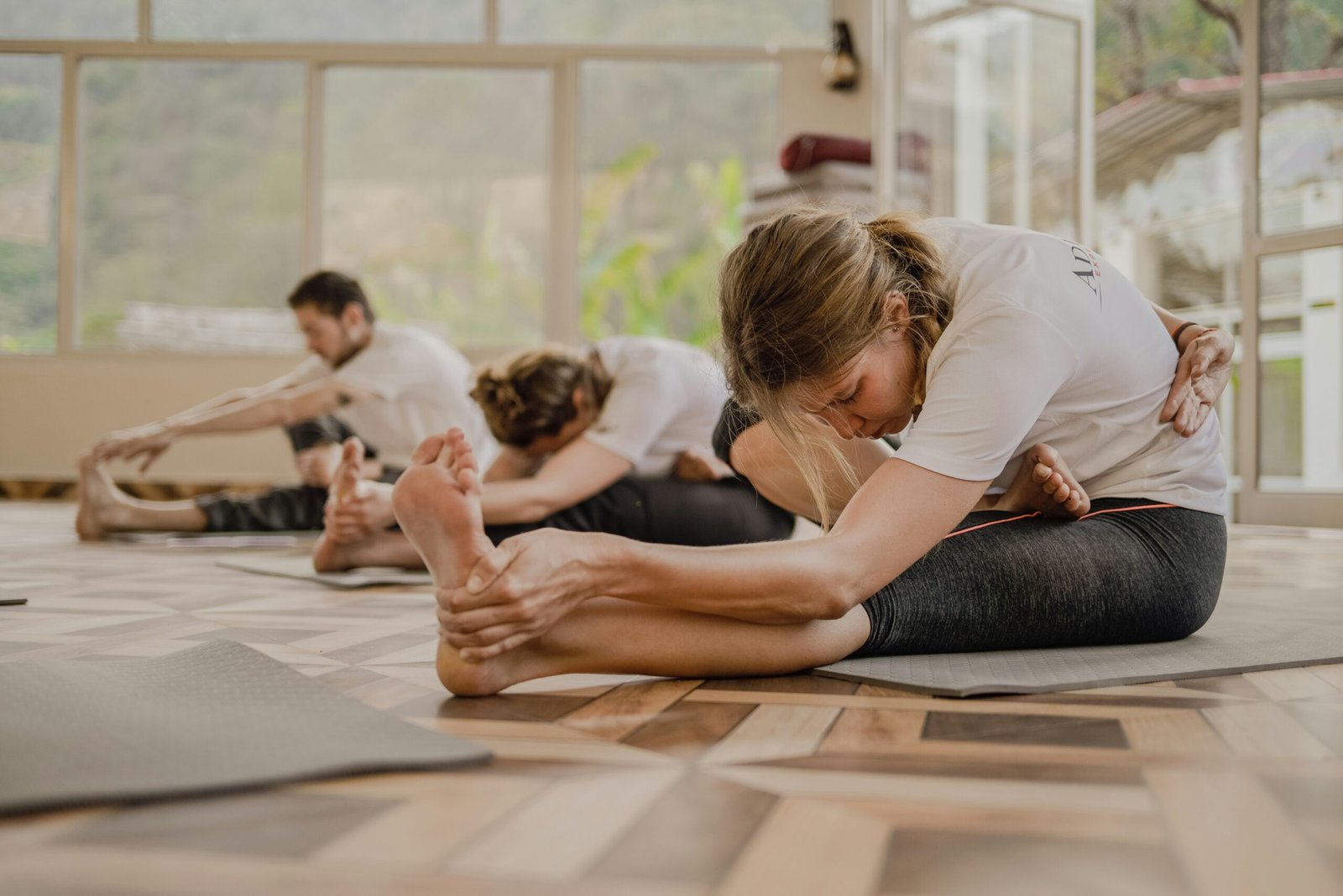 Group meditation session at a yoga studio in Rishikesh, adding a grounded spiritual atmosphere to an Ayurveda retreat article.