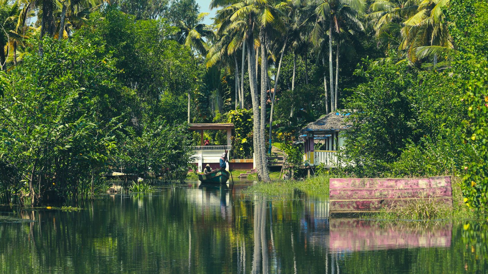 Quiet boat on the Kerala backwaters, reflecting the slower pace and evening calm of an April retreat in southern India.