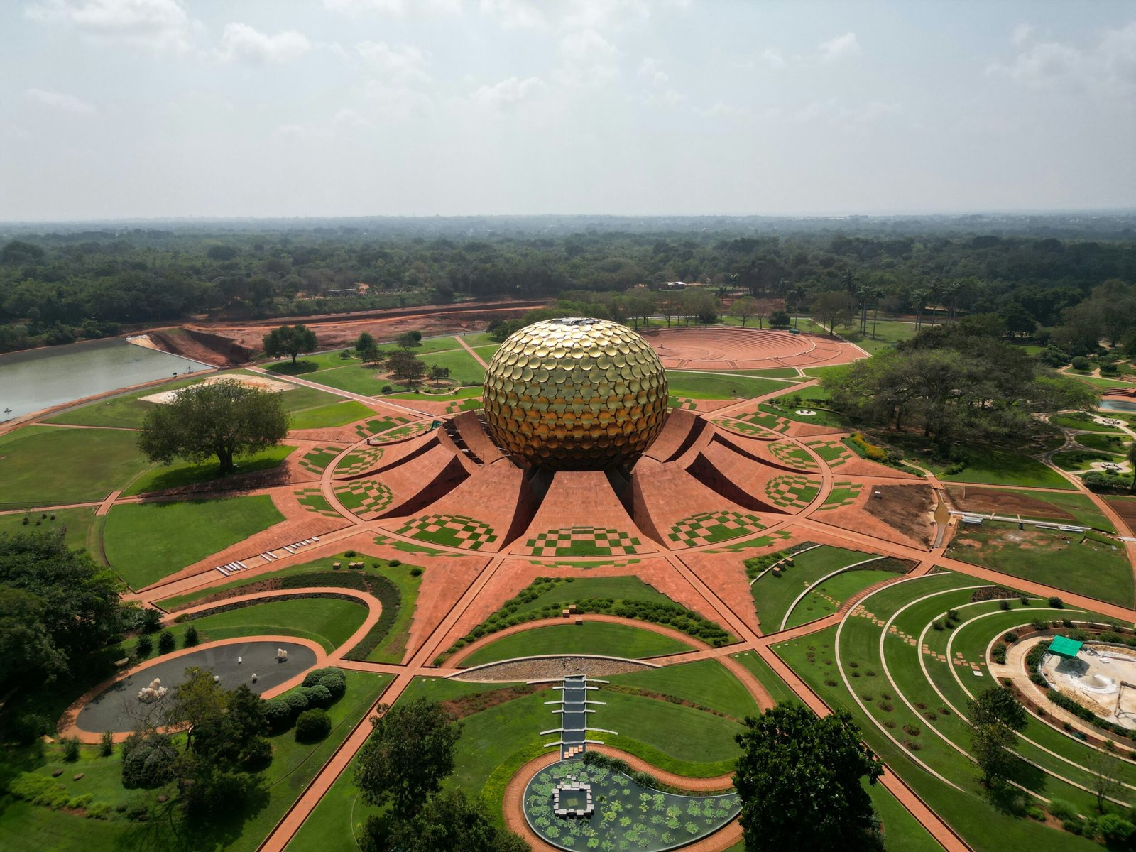 Aerial view of Auroville with Matrimandir at the center, adding a spiritual South India setting to an Ayurveda retreat article.