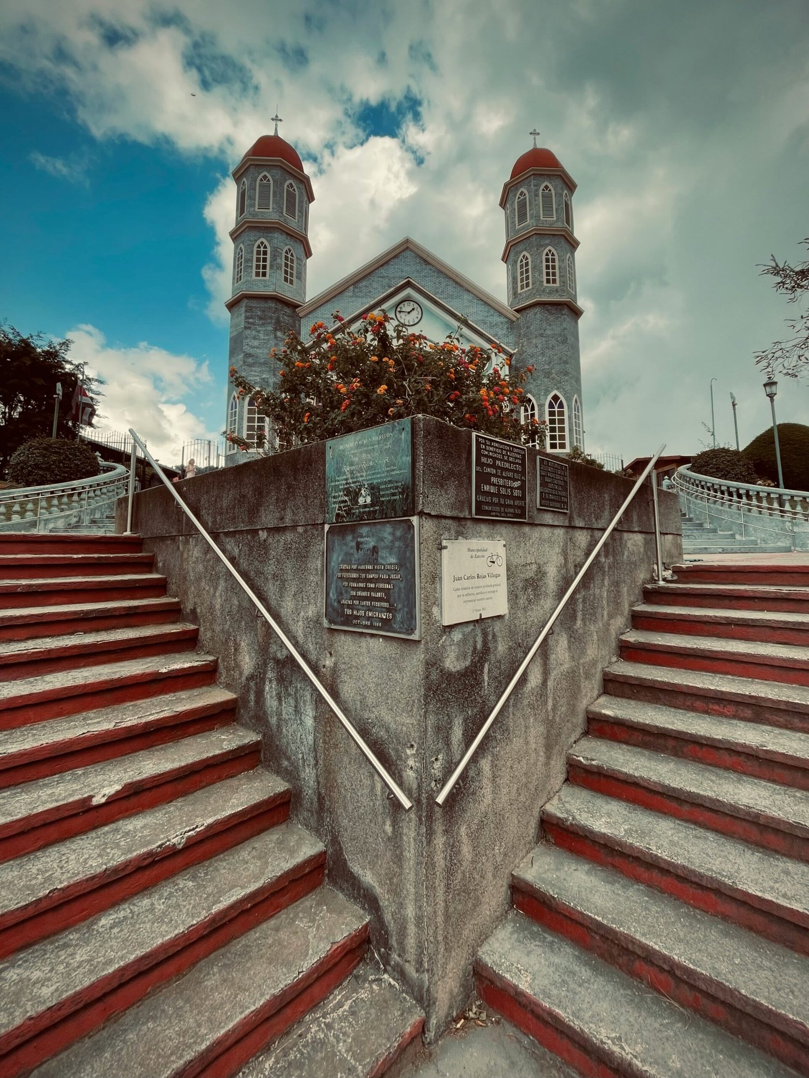 Church facade framed by flowers in Zarcero, Costa Rica
