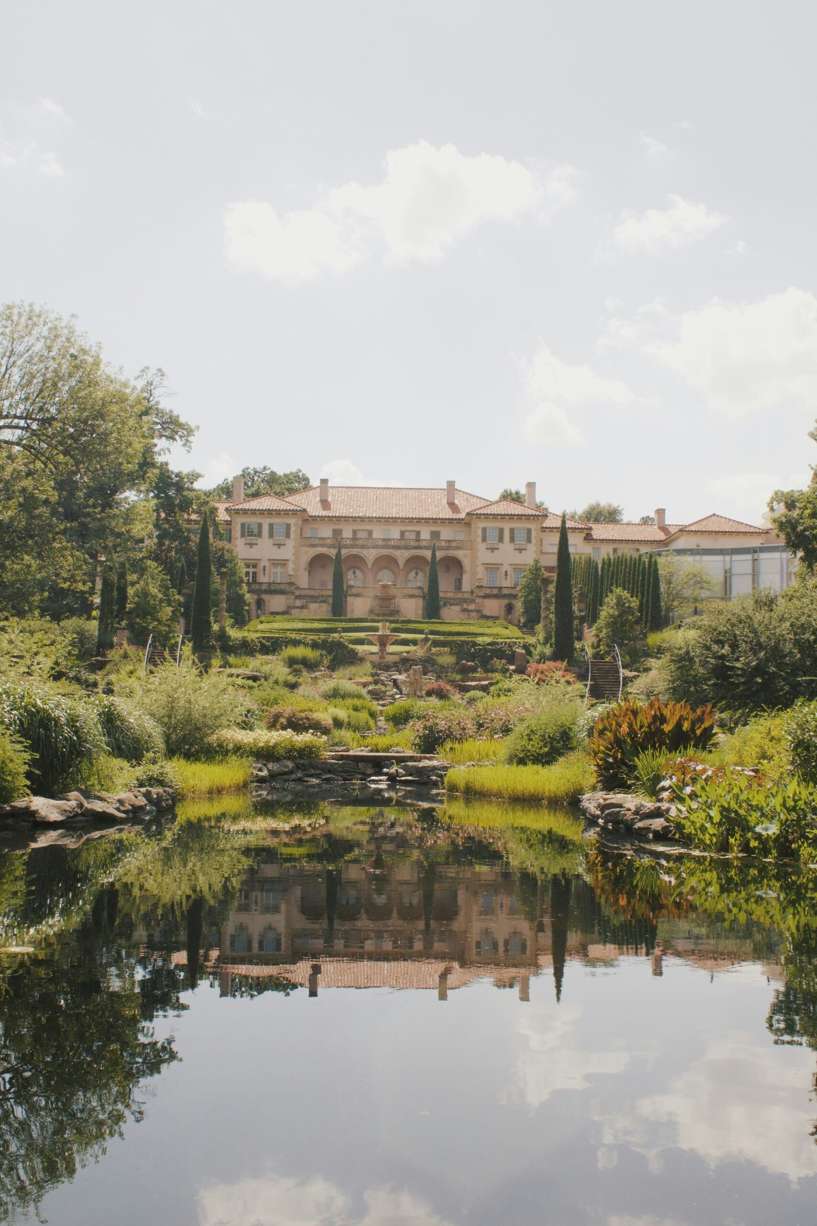Elegant garden estate with a reflective pond suited to a calm and restorative Ayurveda escape