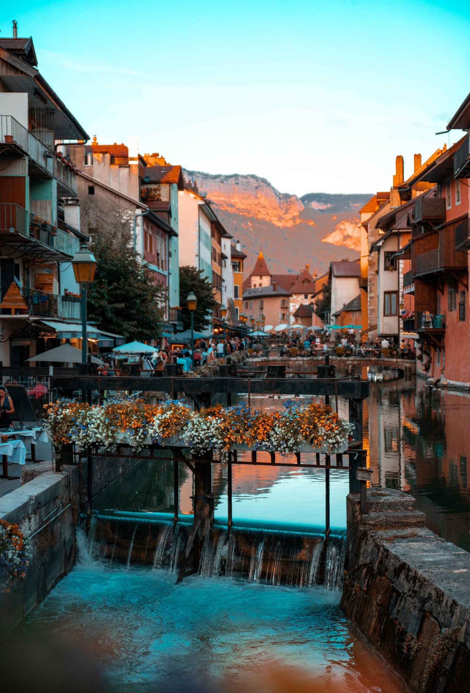 Waterfront buildings in Annecy with calm lake views, ideal for a France yoga retreat that blends movement with a scenic town atmosphere.