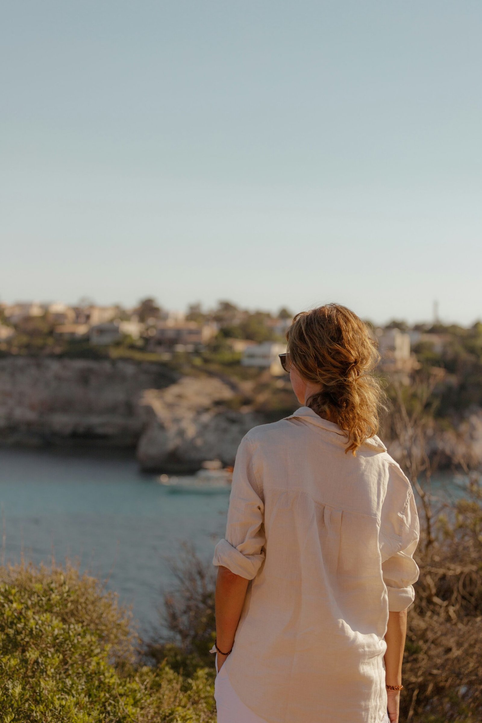 person practicing yoga at sunrise in mallorca spain