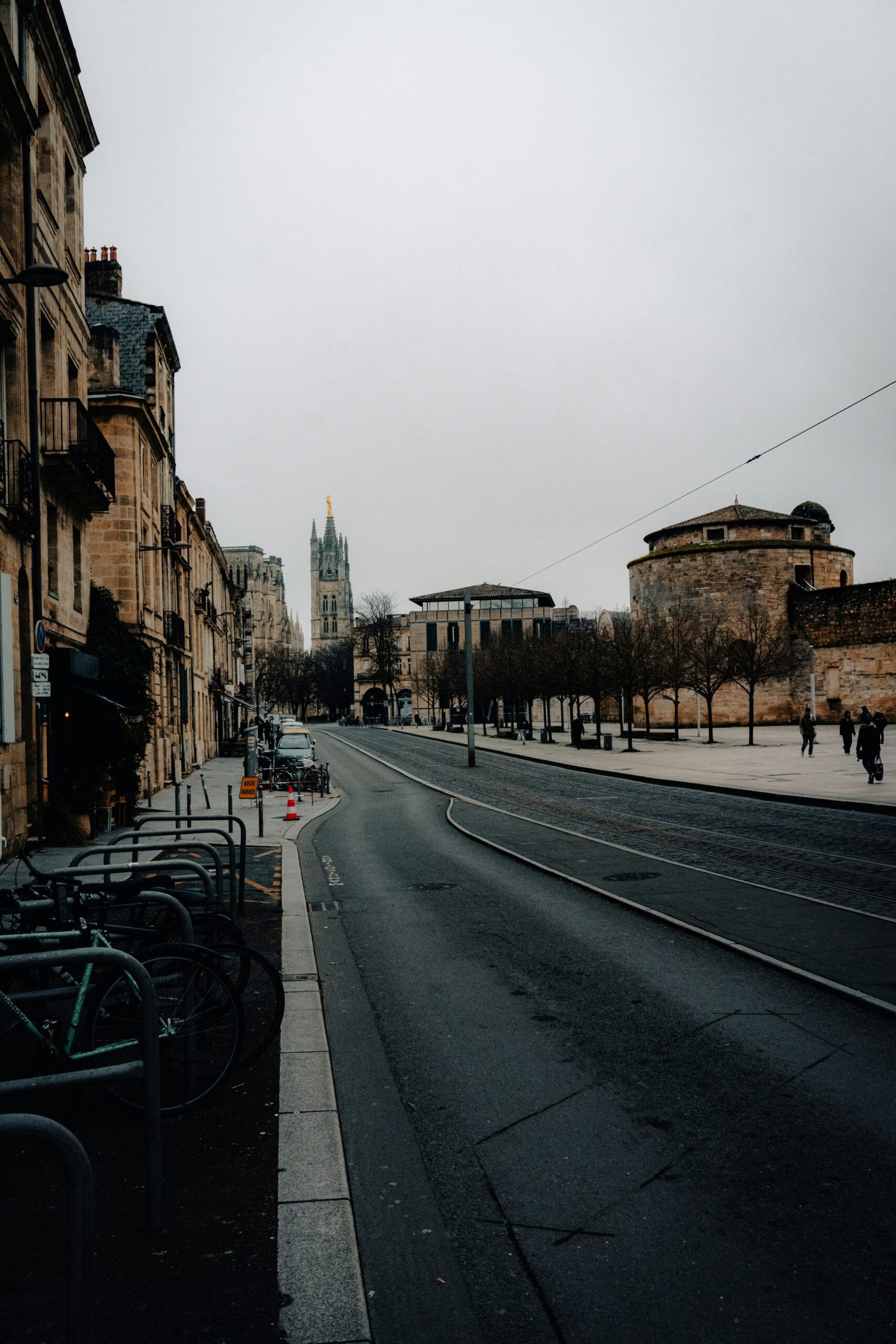 Parked bicycles along a quiet Bordeaux street, bringing an easy local rhythm and urban charm to a France yoga retreat.