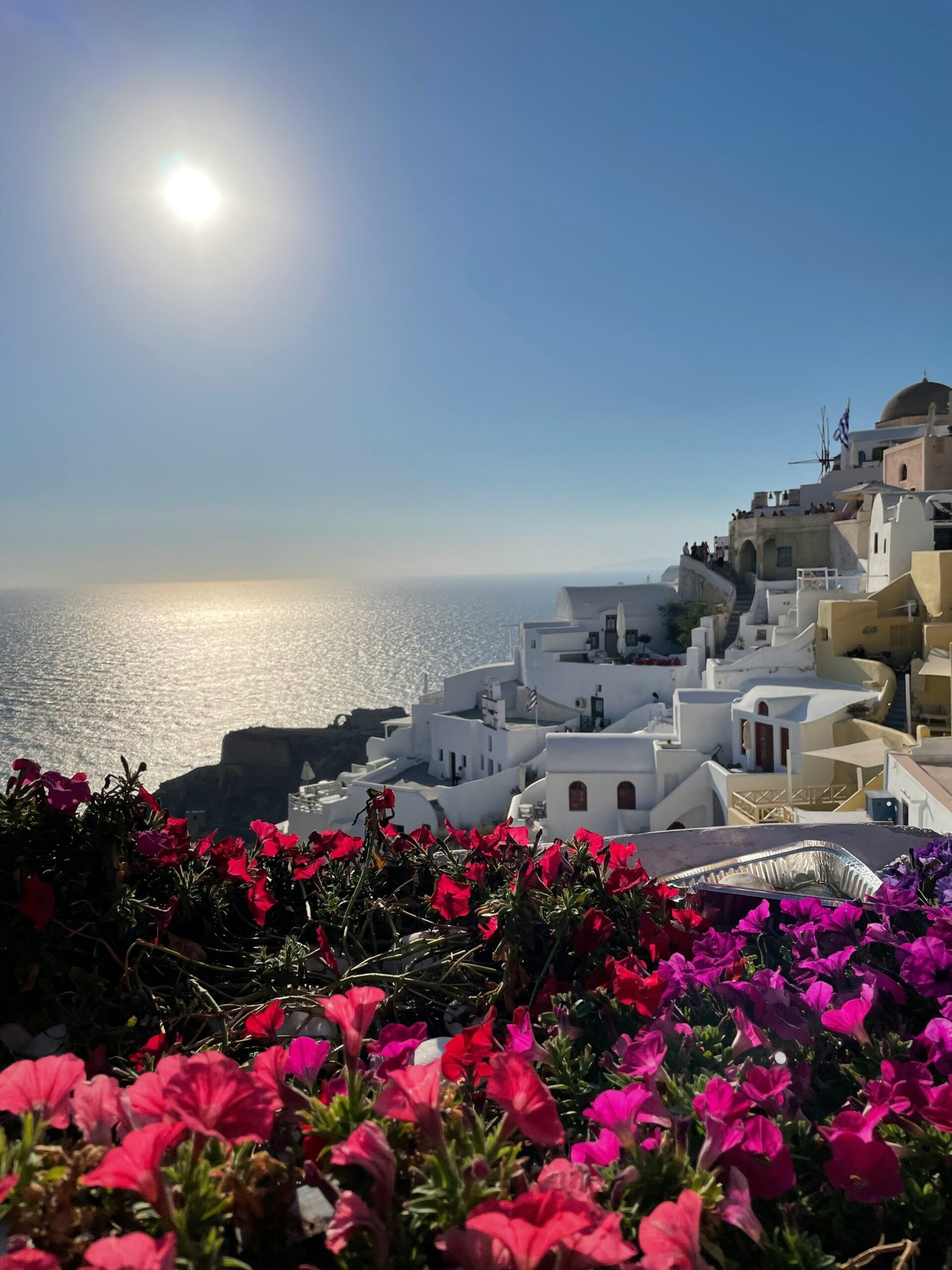Santorini and Therasia across the water at dusk, creating a quiet and elevated setting for a reflective retreat in Greece.
