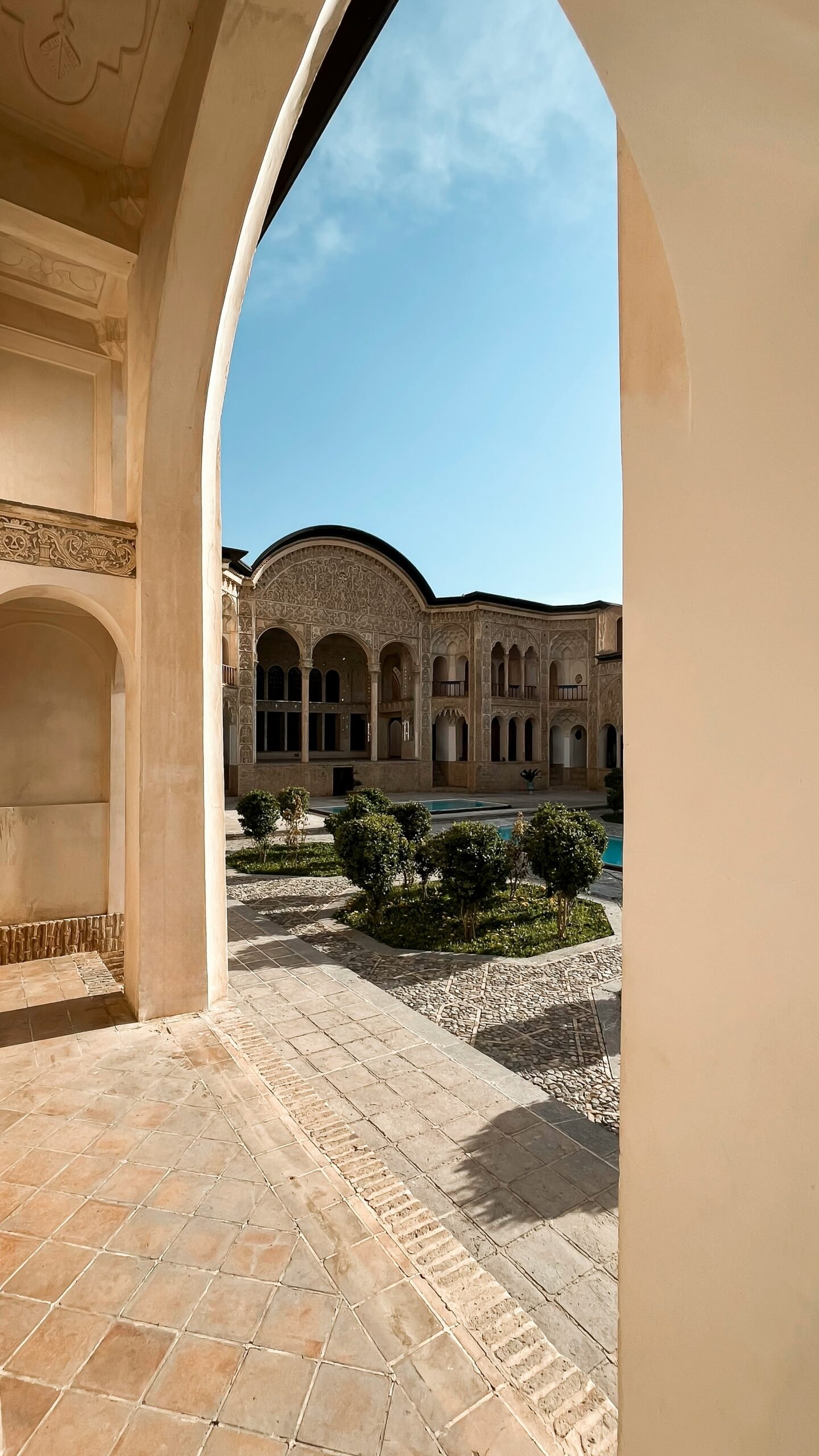 shaded riad courtyard in marrakesh with elegant moroccan design