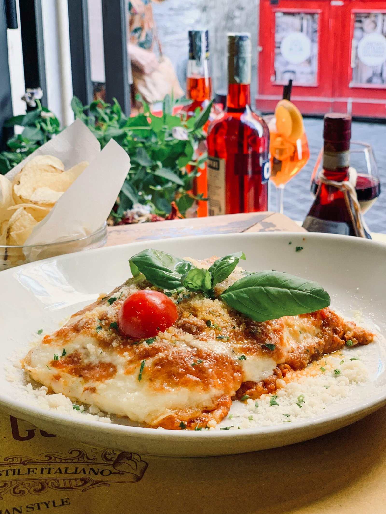 The art of slow cooking and mindful preparation captured in a delicious plate of lasagna at a quiet Italian cafe.