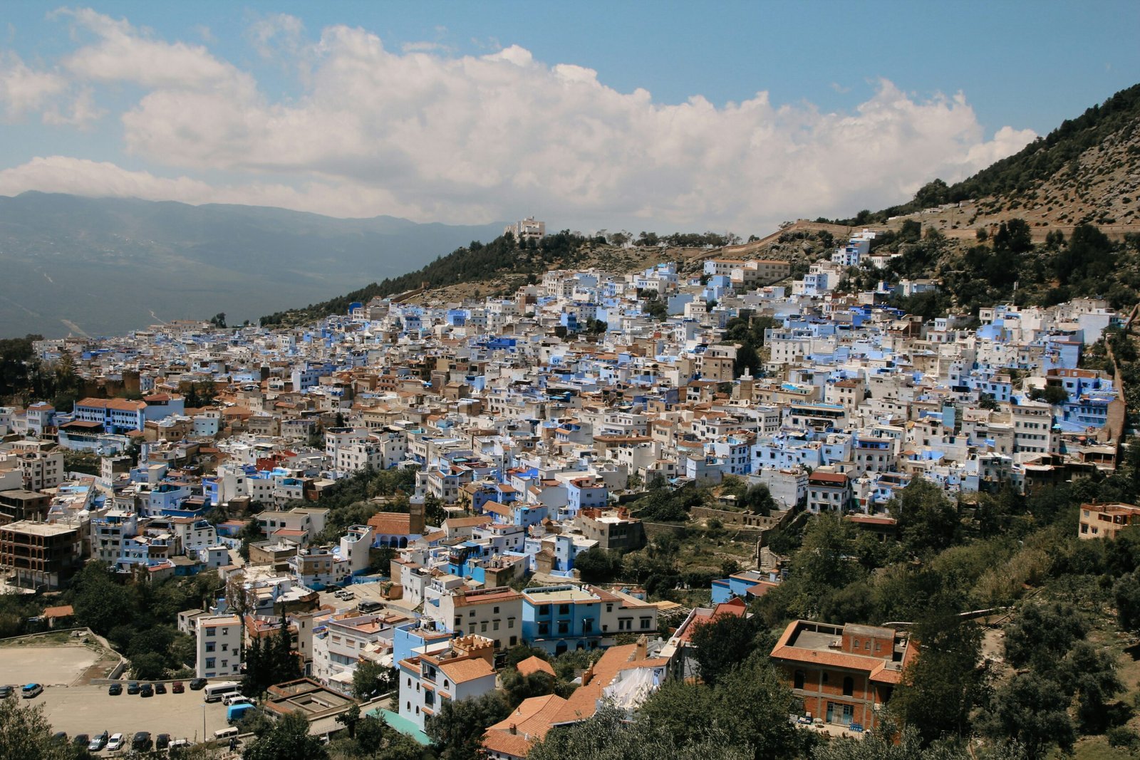 panoramic view of chefchaouen morocco with blue buildings and hillside setting