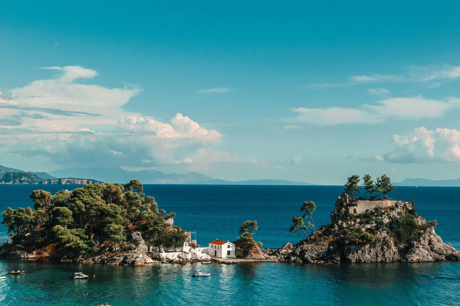 Small rocky island off the coast of Parga, Greece, reflecting the secluded and restorative mood of a coastal retreat.