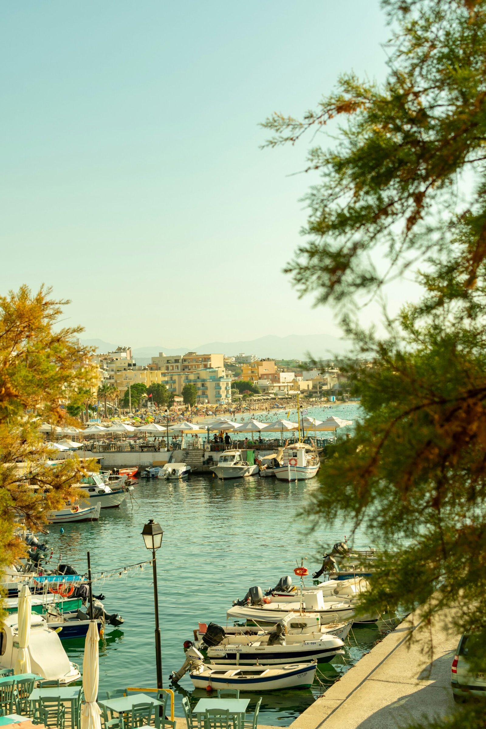 Quiet harbor in Crete with still water and boats, matching the peaceful mood of a February retreat.