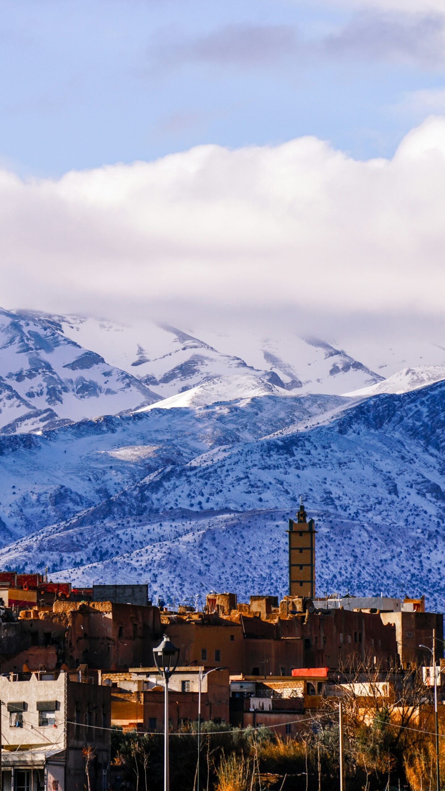 snowy mountains above a moroccan village in midelt during winter