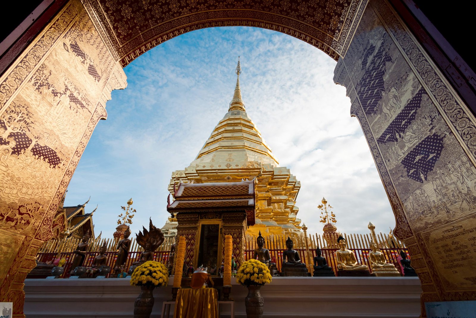 temple arch at doi suthep in chiang mai beneath bright northern thailand sky