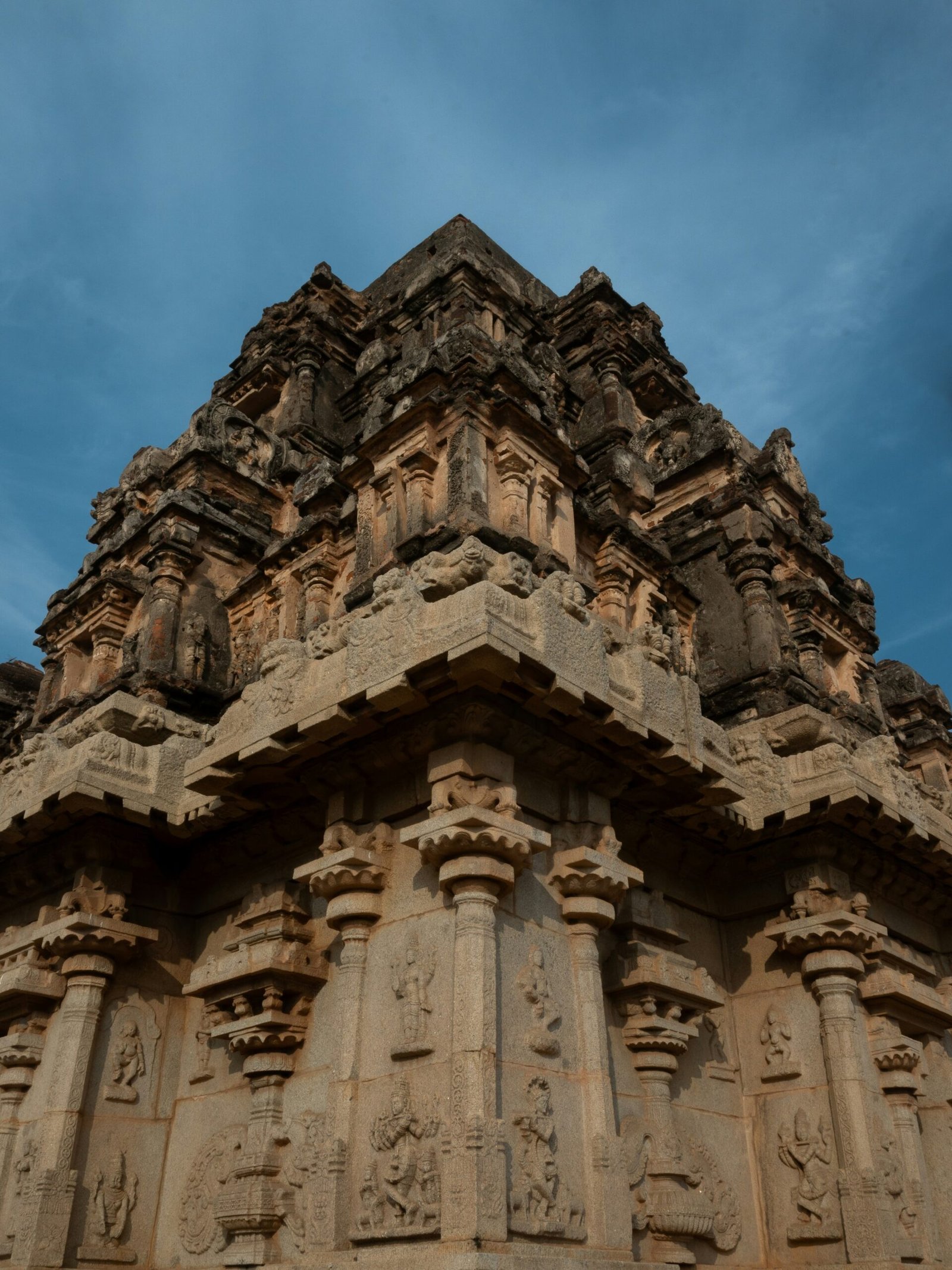 Ancient temple structure in Hampi, offering a historic and meditative backdrop for a yoga retreat in India.