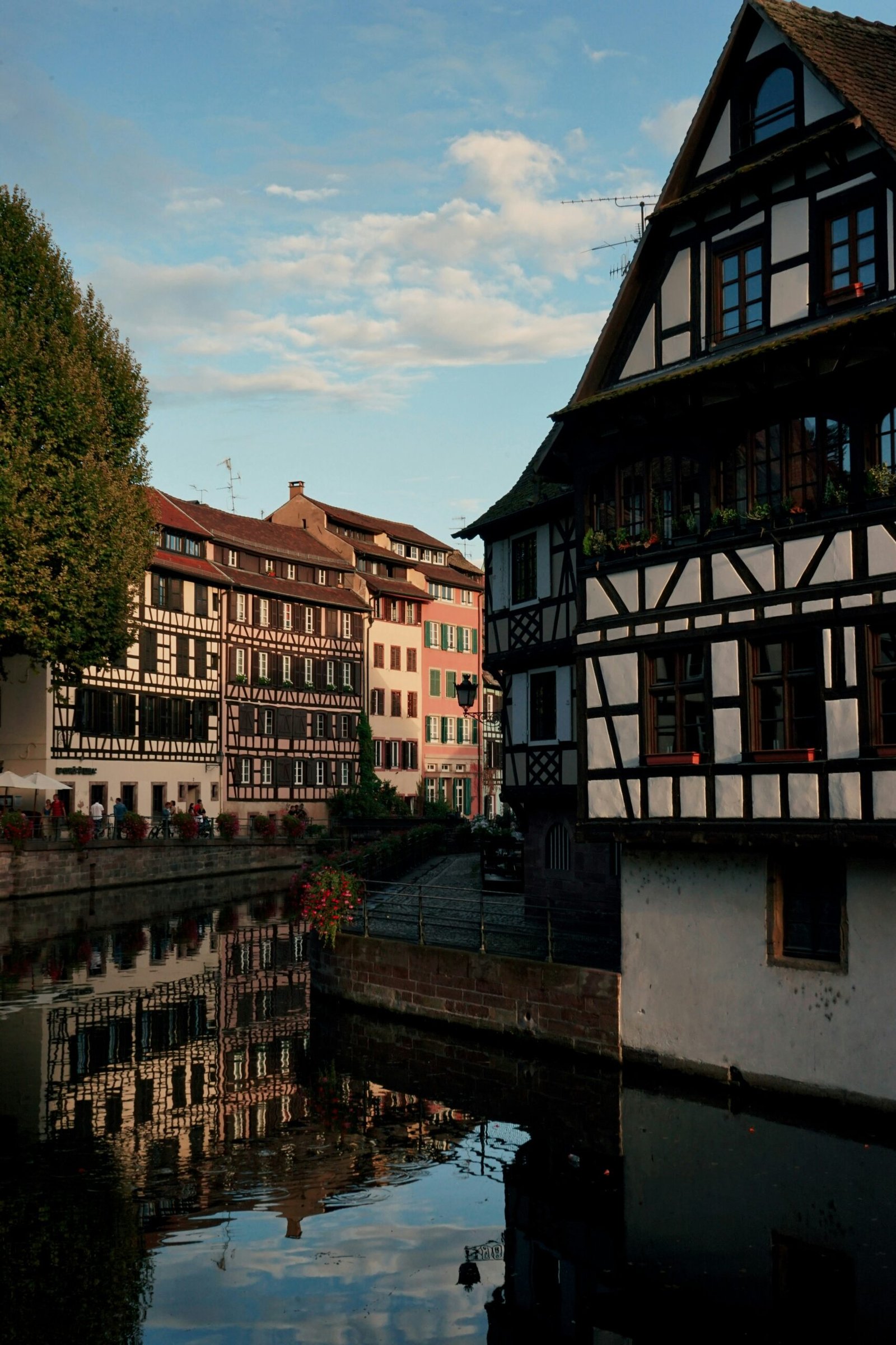 Strasbourg canal between historic buildings, bringing a calm and scenic city atmosphere to a winter yoga retreat in France.
