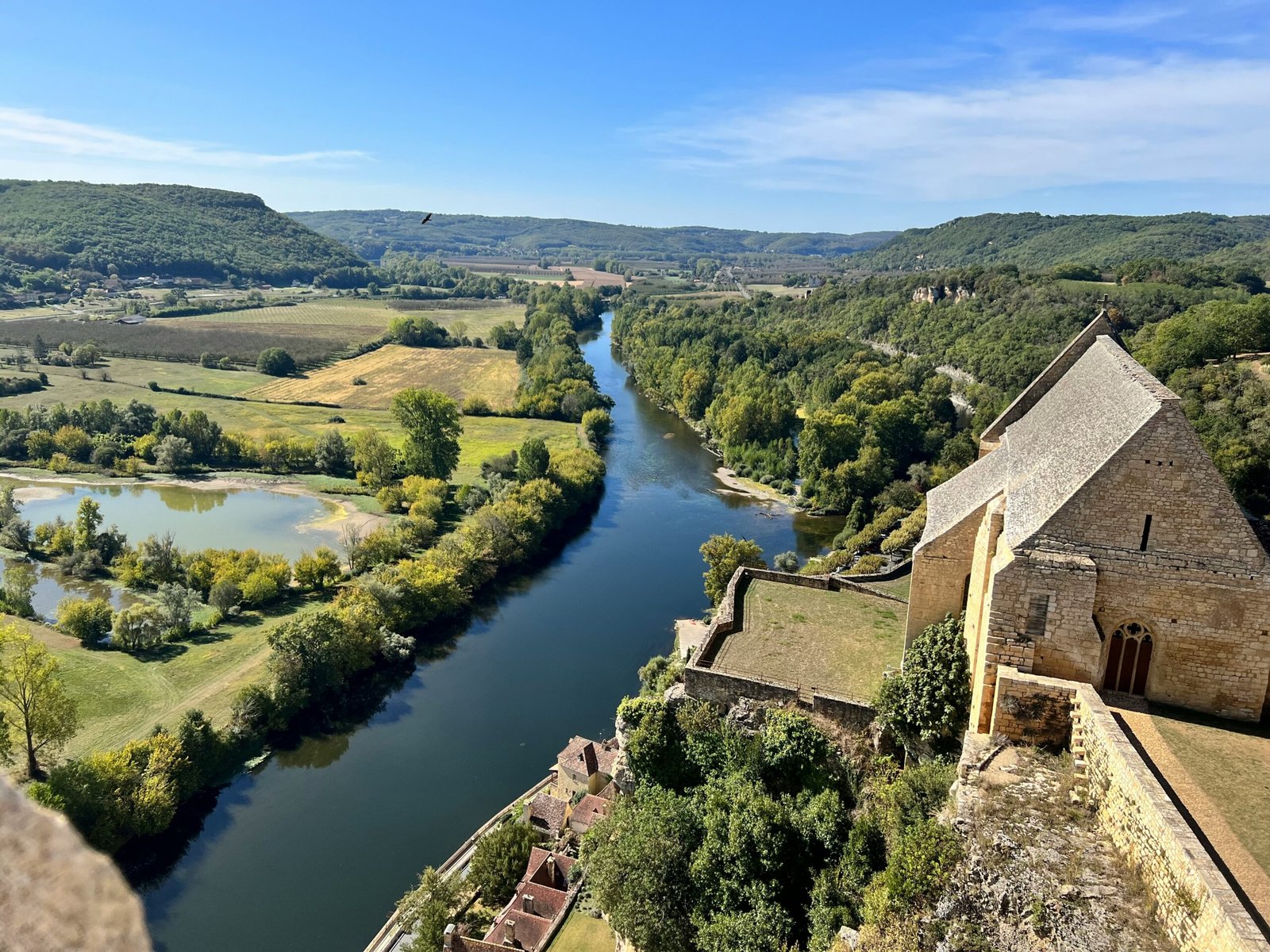 Green river landscape in Dordogne, suited to a peaceful France yoga retreat surrounded by nature in early summer.