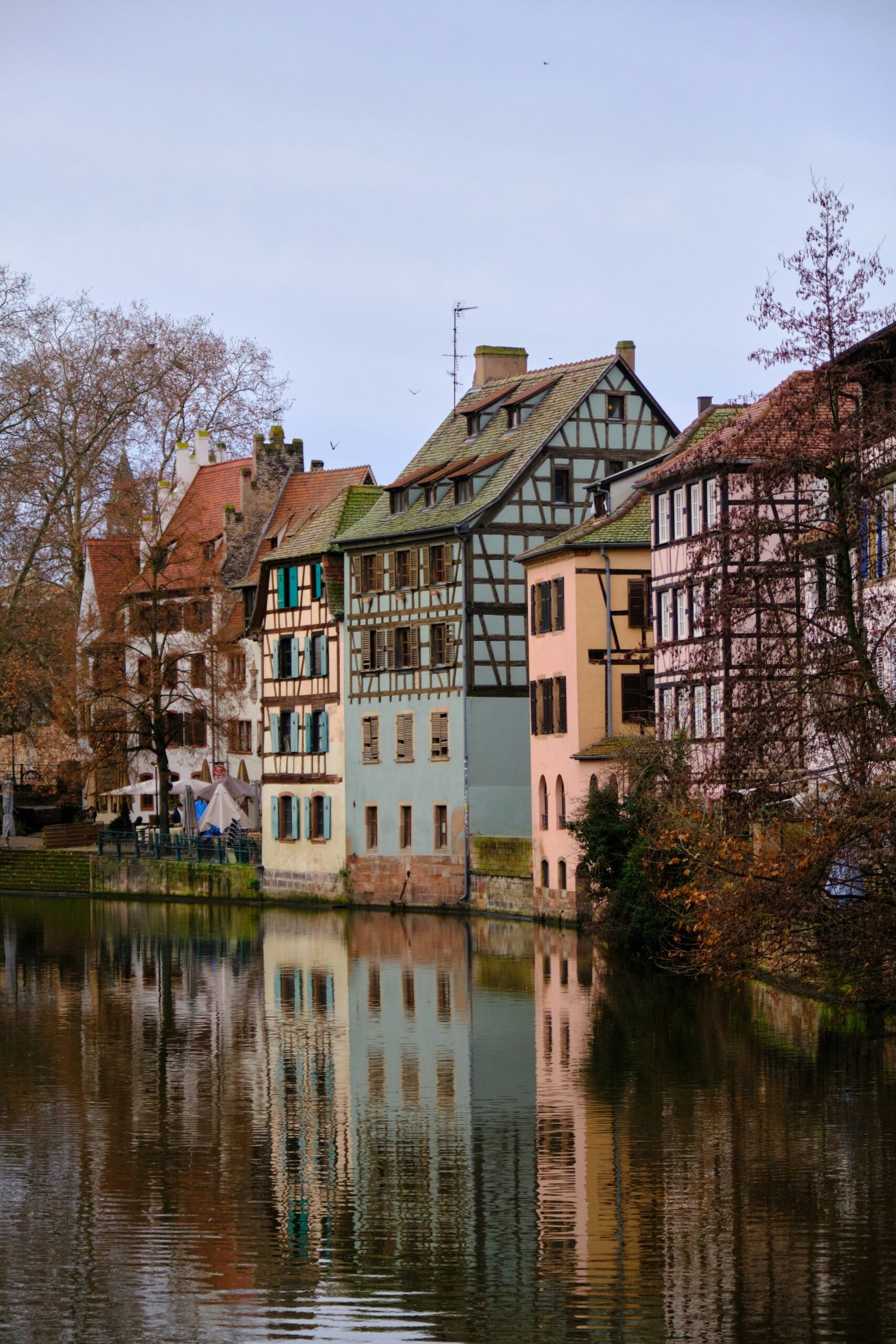 Canal and half-timbered houses in Petite France, Strasbourg, offering a charming waterside backdrop for a France yoga retreat.
