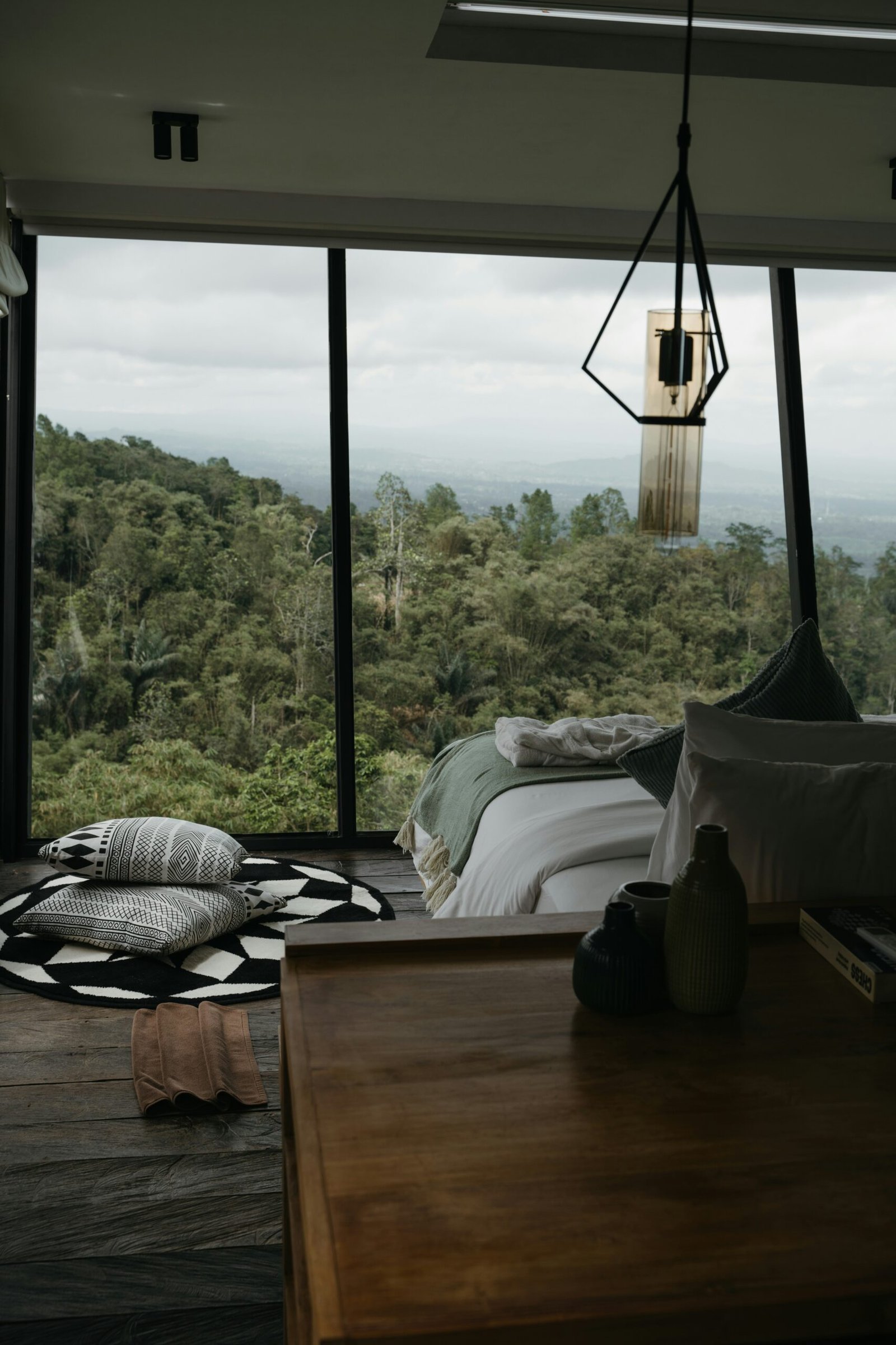 Forest-view retreat bedroom designed for rest, stillness, and a nature-filled escape