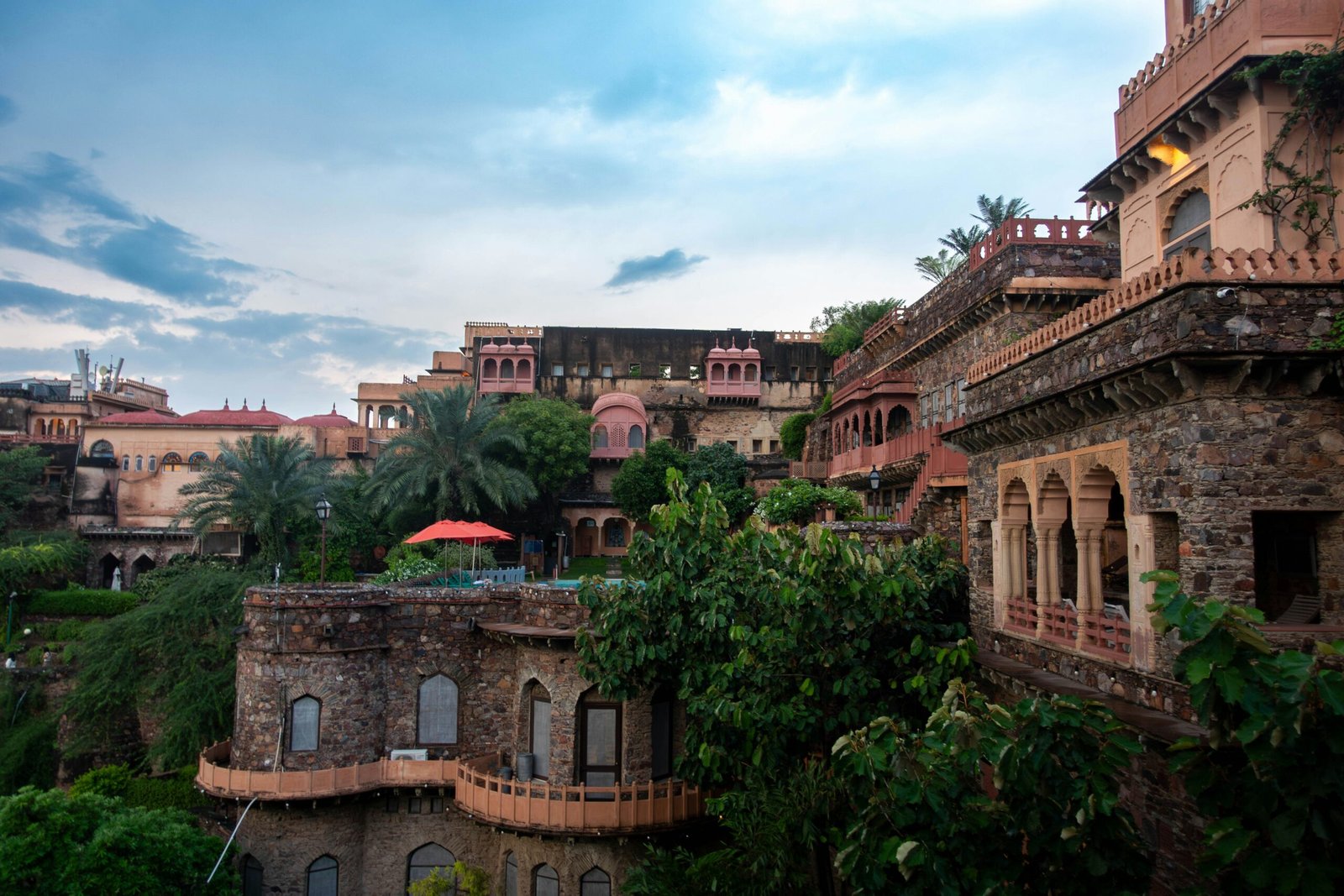 Historic palace resort surrounded by greenery, adding a serene and luxurious setting to an Ayurveda retreat theme in India.