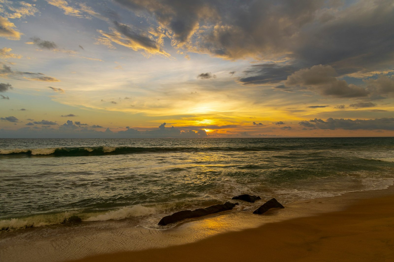 Sunset over Bentota Beach reflecting the warm renewing mood of an April wellness retreat in Sri Lanka.