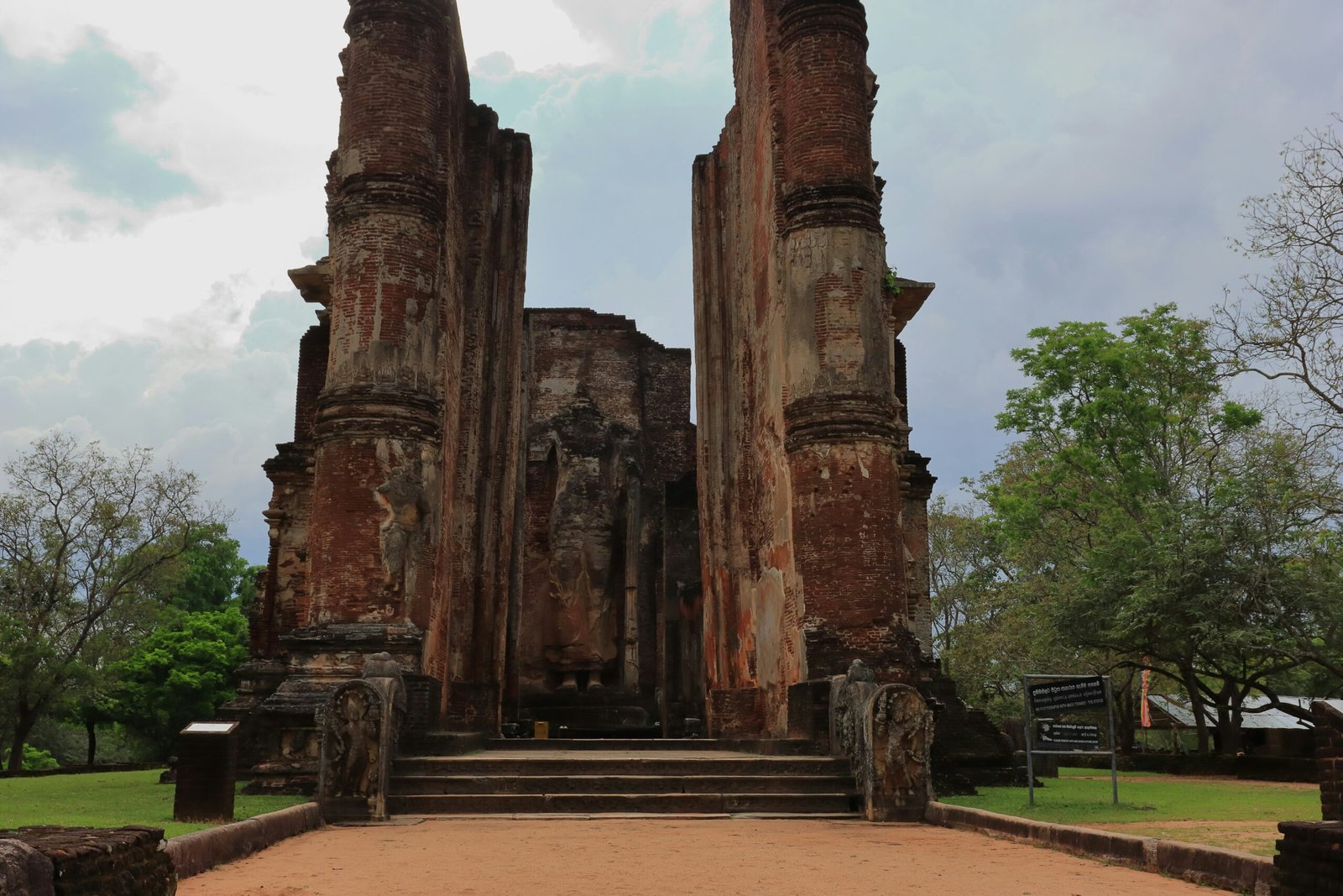 Ancient stone pillars and ruins inside the historic city of Polonnaruwa.
