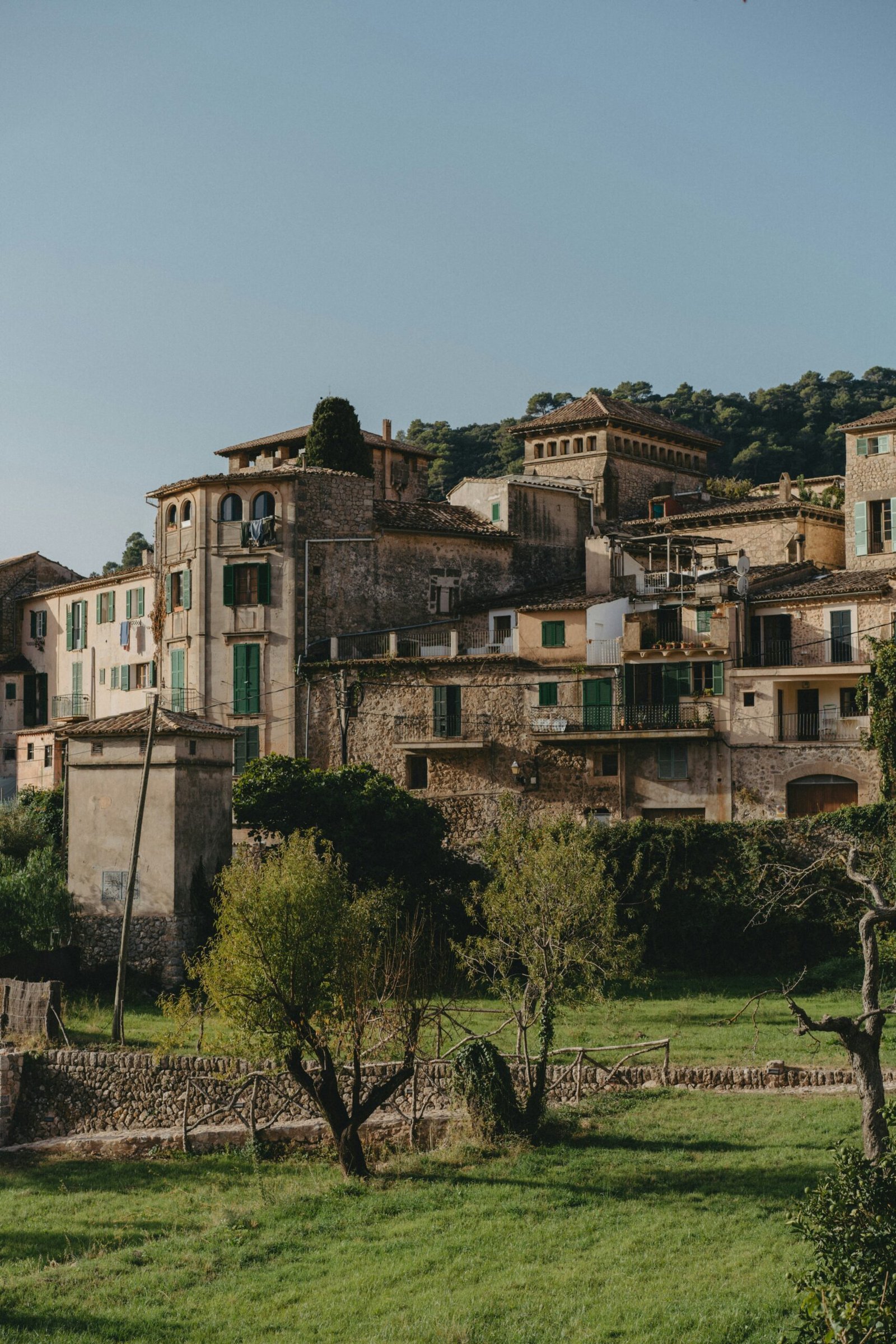 Medieval hill village with green countryside views, creating a peaceful and grounding backdrop for a France yoga retreat.