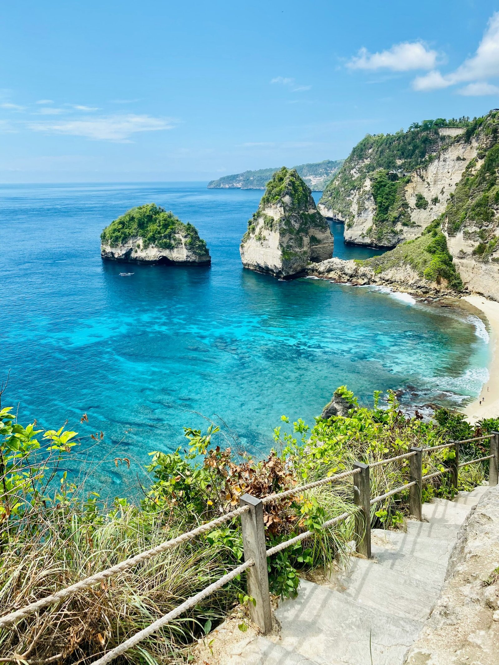 uluwatu clifftop above bright blue water during bali high season in july